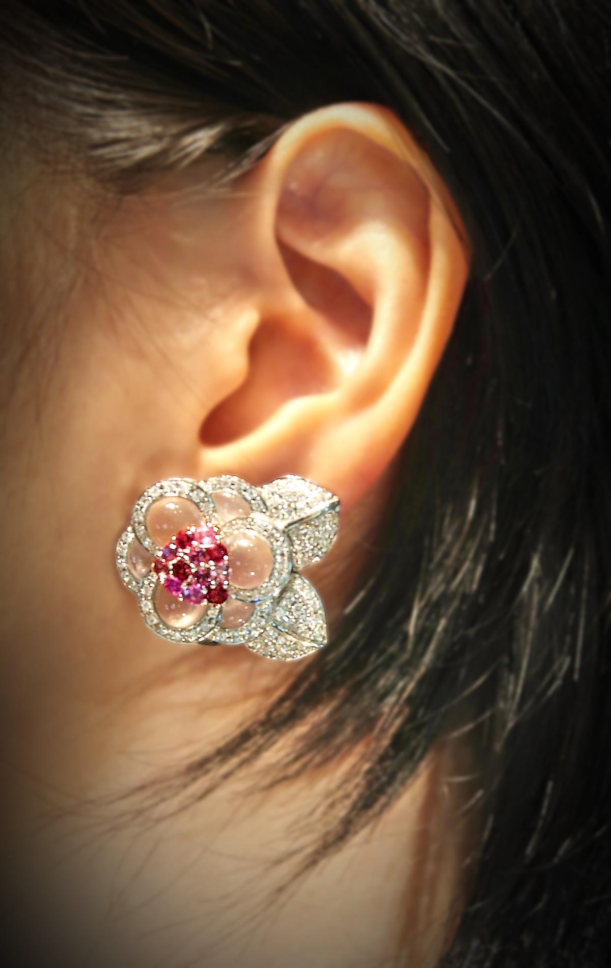 Flower Clip-on Earrings with Collapsible Posts in 18K White Gold embellished with Diamonds and Pink Stones in multiple shades, Cabochon Rose Quartz, Pink Sapphire and Rhodolite.

Suitable for Pierced / Non-Pierced Ears

Diamond: Round Brilliant,