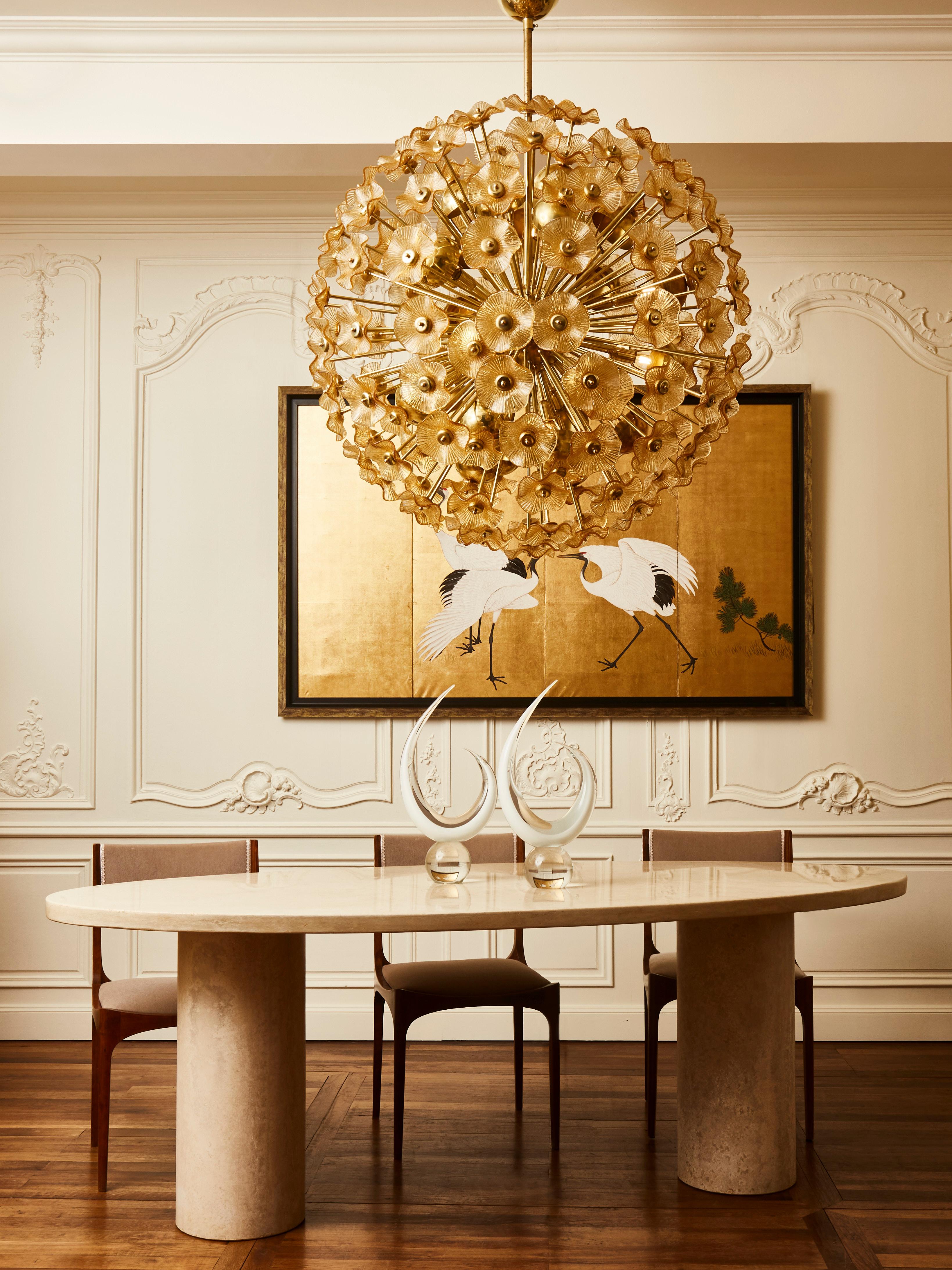 Stunning sputnik chandelier in brass with sculpted Murano glass flowers.
Creation by Studio Glustin.
 