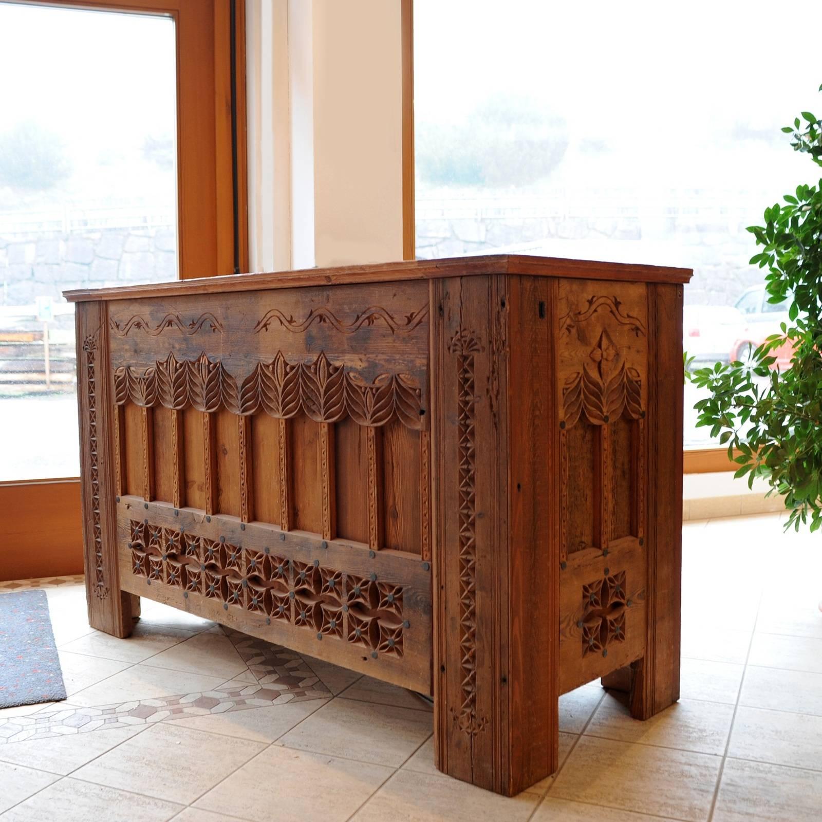 A stunning piece of functional decor, this chest is inspired by the gothic style of the Elsass region in France, bordering with Germany. Its one-of-a-kind allure comes from the larch used to craft it, which is 400 to 600 years old. The hand-carved