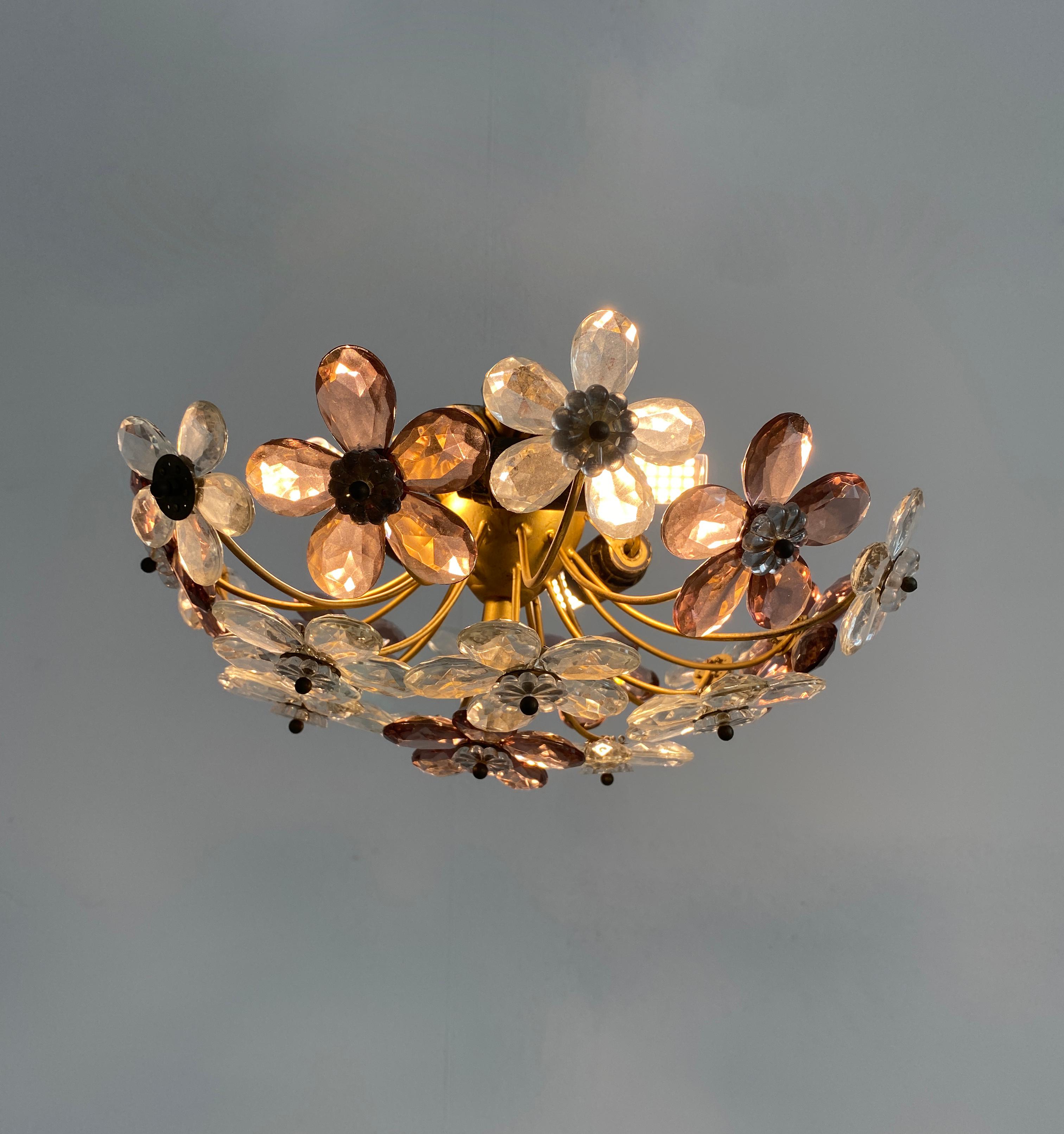 Pair of petite Murano flower flush mounts, Italy circa 1950 - priced individually

Delicate petite floral ceiling lights with smooth cut crystals and brass accents, 3 light sources (e14 / 40 W each). Led's possible. The condition is very