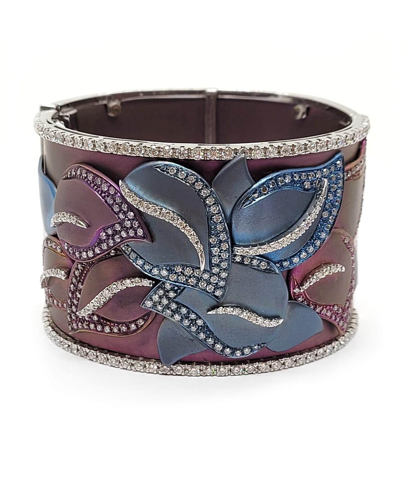 Flower Cuff Bracelet Diamond Titanium 18k Gold Andreoli

This Andreoli flower cuff bracelet features an elaborate and intricate artisanship titanium work with 5.46 carats of round brilliant cut diamonds. Set with 63.30g of 18K White Gold and