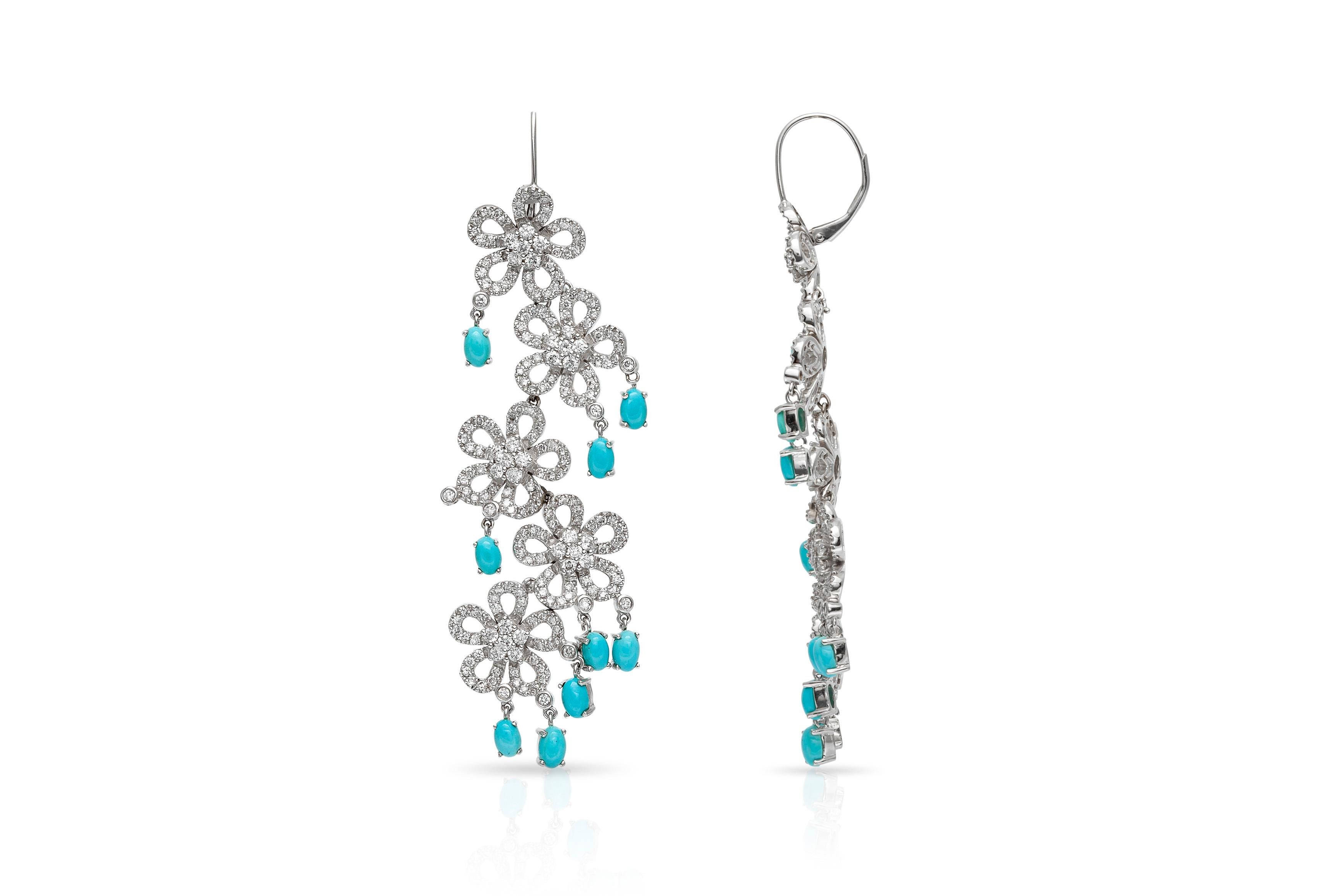 Five flowers per each earring finely crafted in 18k white gold with diamonds weighting approximately a total of 5.10 carats and turquoise weighting a total of 4.93 carats.
Circa 1980's.