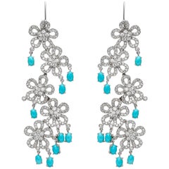 Boucles d'oreilles pendantes fleur avec diamants et turquoise