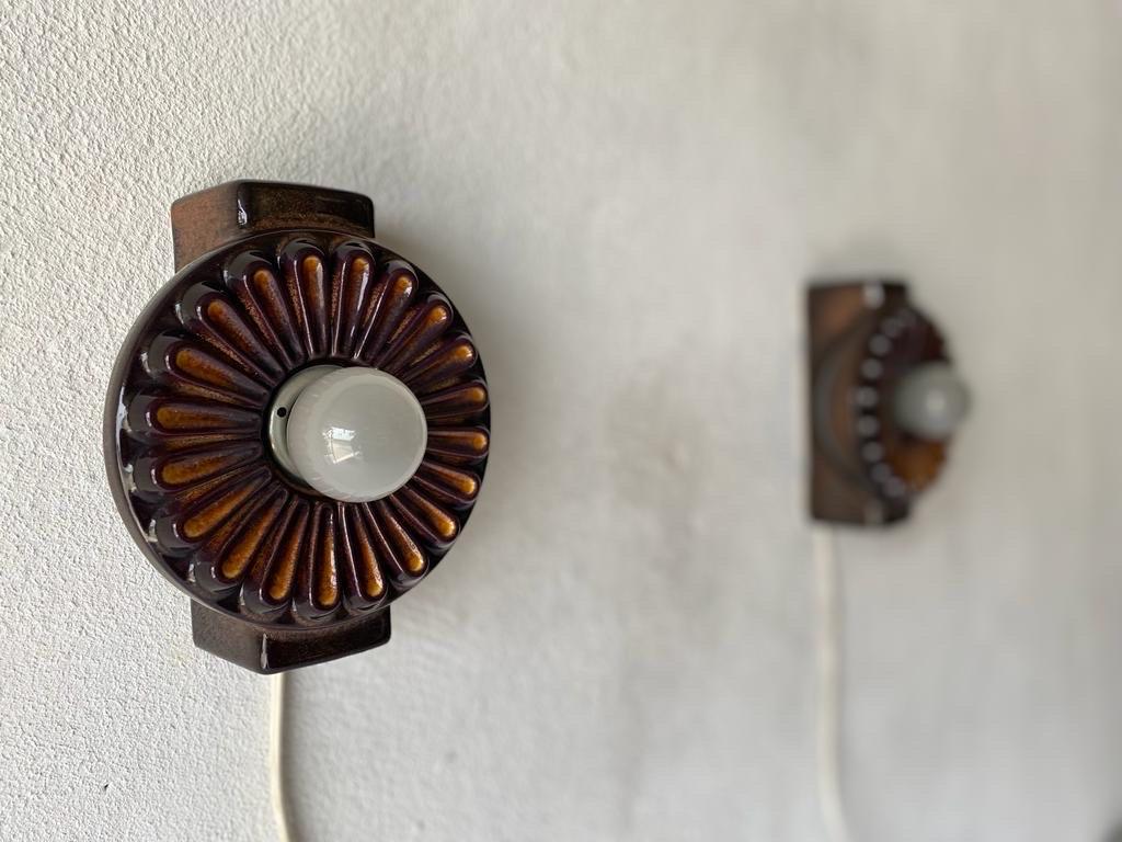 Flower Design Ceramic Pair of Wall Lamps, 1960s, Germany

Very nice high quality wall lamps.

Lamps are in very good vintage condition.

These lamps works with E27 standard light bulbs. 
Wired and suitable to use in all countries. (110-220