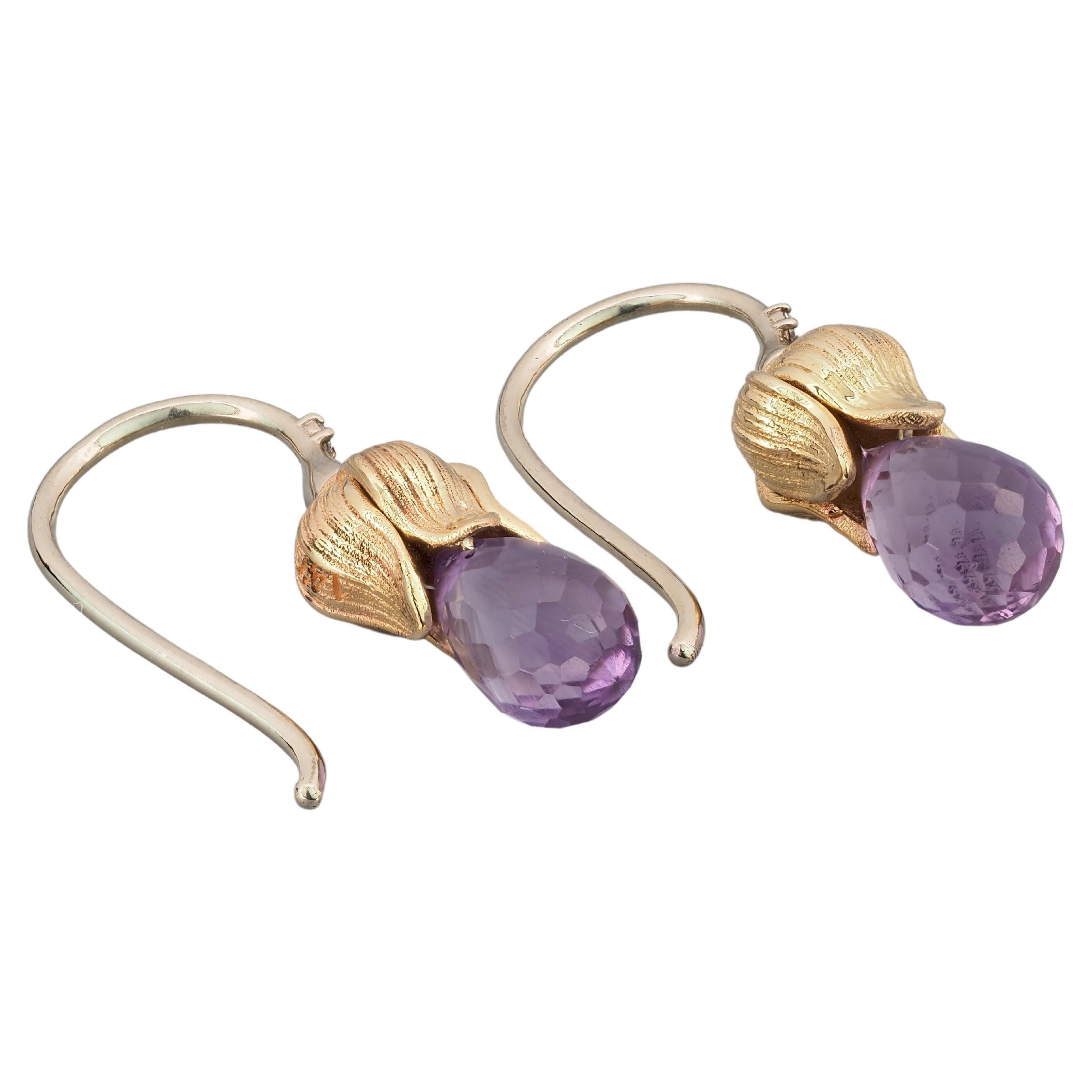 Flower design earrings with natural amethysts and diamonds. Gold color yellow and white - 14k marked. February birthstone. 
Size: 21 x 6 mm.
Weight: 2.55 g.

Gemstones:
Natural amethysts: 2 pieces, approx - 2.00 ct total, violet color.
Briolette