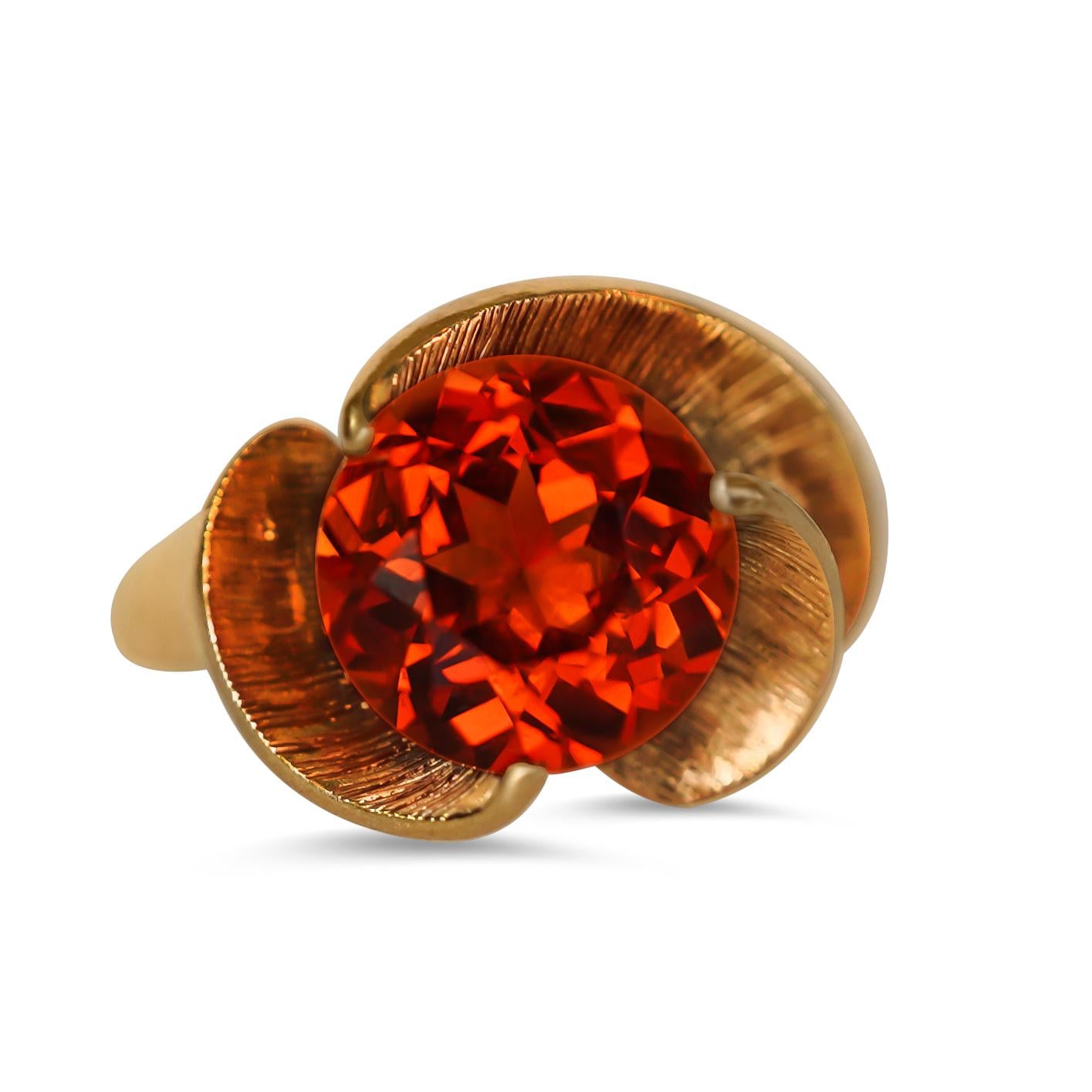 A flower design orange quartz topaz cocktail ring in 14k yellow gold. 
Stone Cut: round cut
Stone Clarity: eye clean
Stone color: orange red
Gemstone size: 9 mm
Ring size: 13 mm long x 16.1 mm wide, 8.5 in U.S. size.
Inner ring circumference: