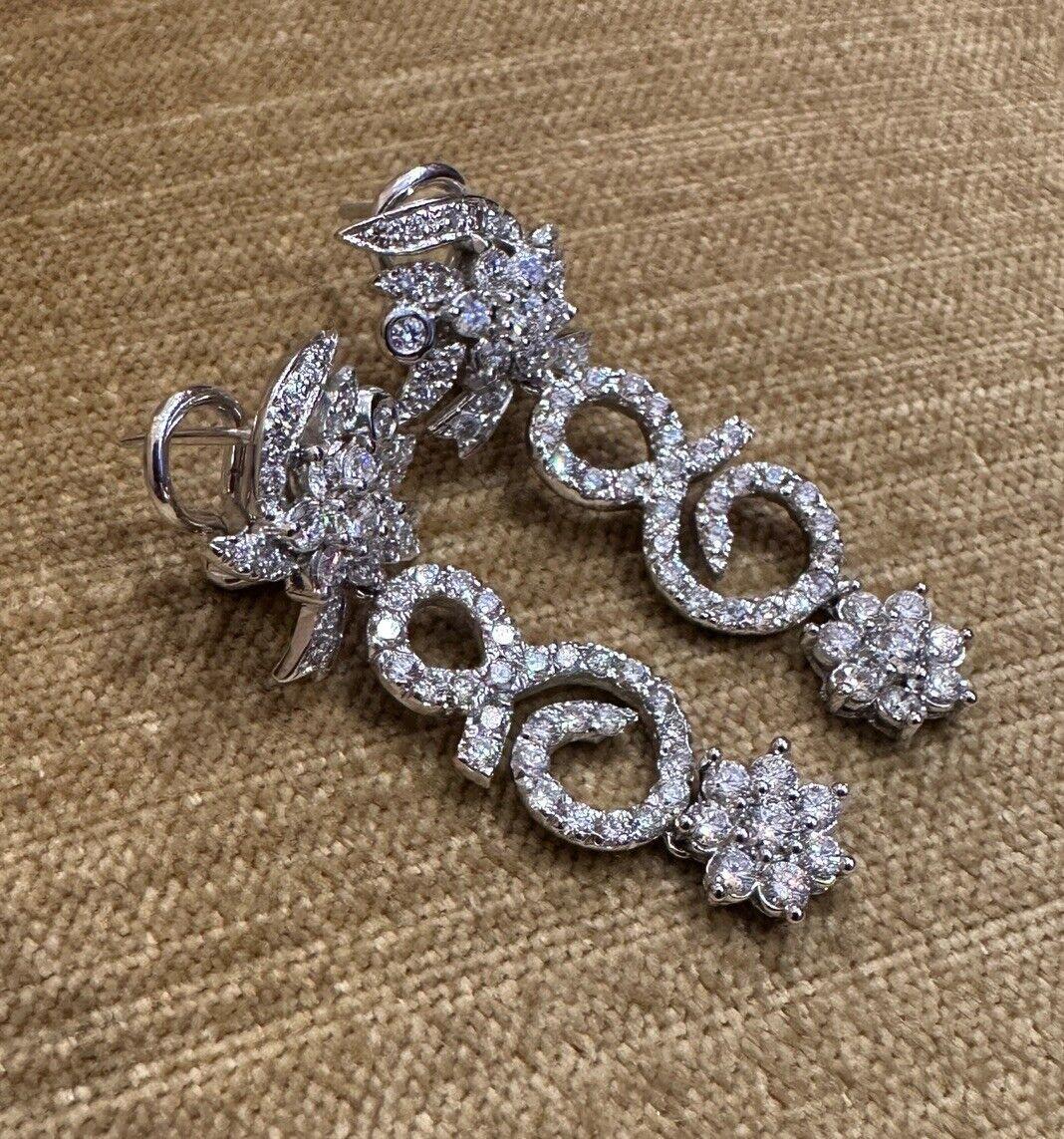 Flower Diamond Drop Earrings 3.00 carat total weight in 14k White gold 

Diamond Drop Earrings features a Floral Scroll Drop Motif with Round Brilliant Diamonds set in 14k White Gold.

The total diamond weight is estimated to be 3.00