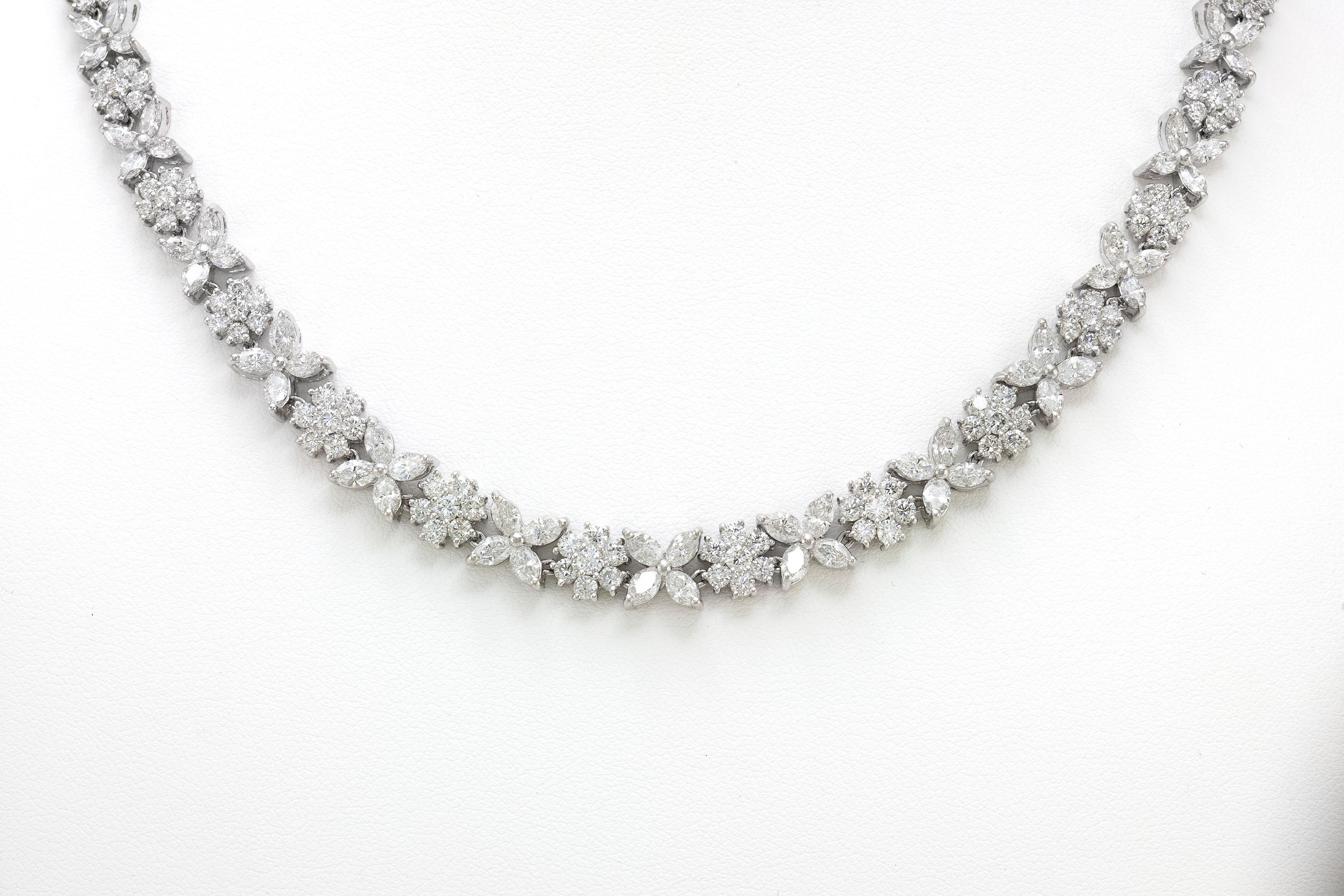 Finely crafted in platinum with round and marquise cut diamonds weighing a total of 18.56 carats.
16 1/2 inches long