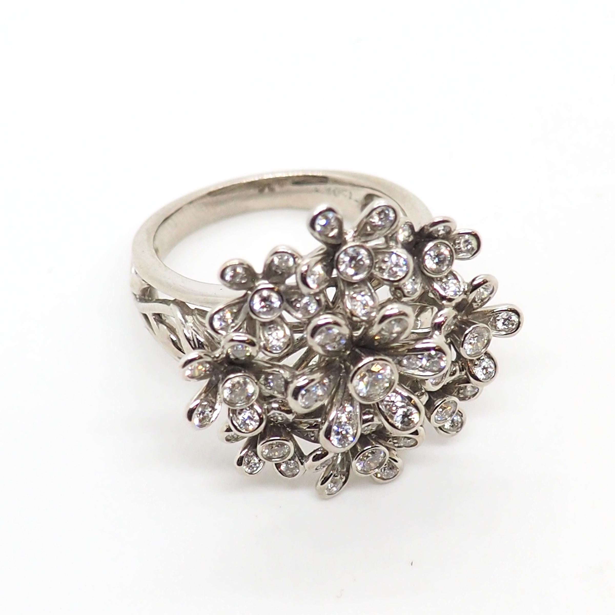 Contemporary fancy diamond flower ring made of 18k white gold. It features 3.5 carats of round brilliant cut diamonds approximately. 

Total weiht: 15 grams

European size: 58
American size: 8.4
Can be resized at the request of the buyer.

The ring
