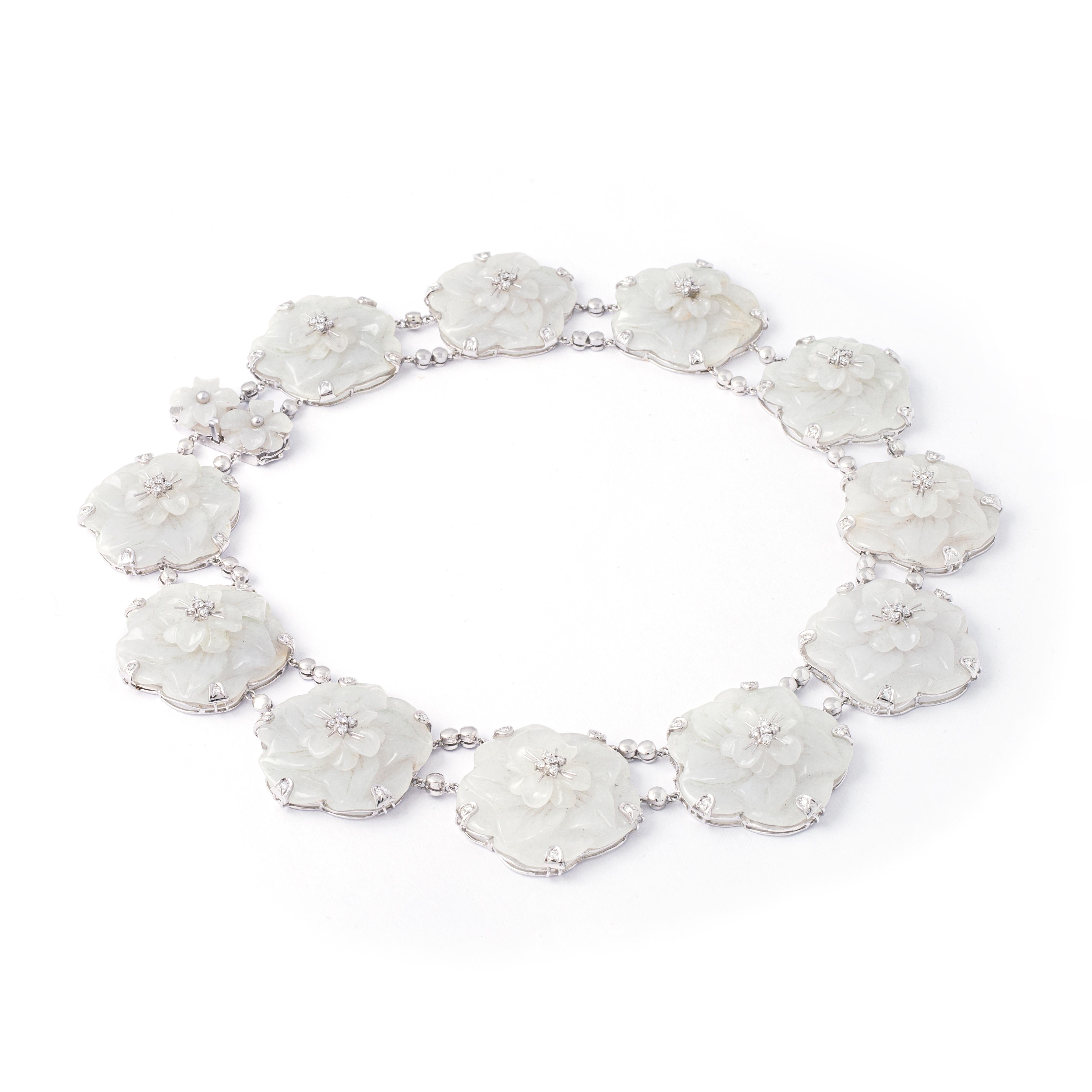 Flower Diamond, probably white jade (not tested) on white gold necklace. Contemporary work.

Total length: approx. 42.50 centimeters.
Width: approx. 3.30 centimeters.