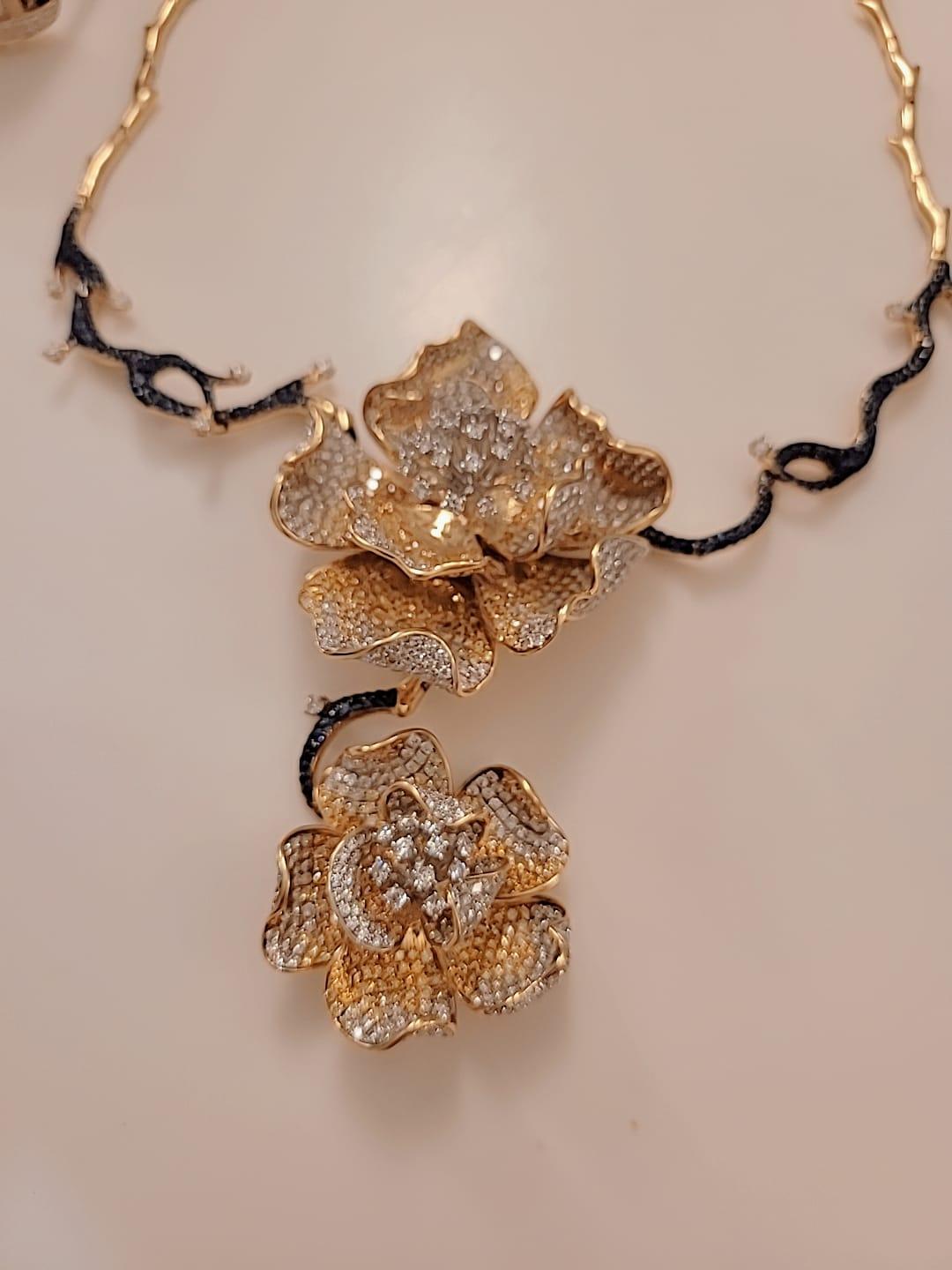 Amazing masterpiece just finished making.

Flower Necklace 
18K GOLD - 95.50 GM 
562 YELLOW DIAMONDS - 8.63 CT
818 DIAMONDS (VS)  - 13.64 CT
283 BLUE SAPPHIRES - 3.670 CT
