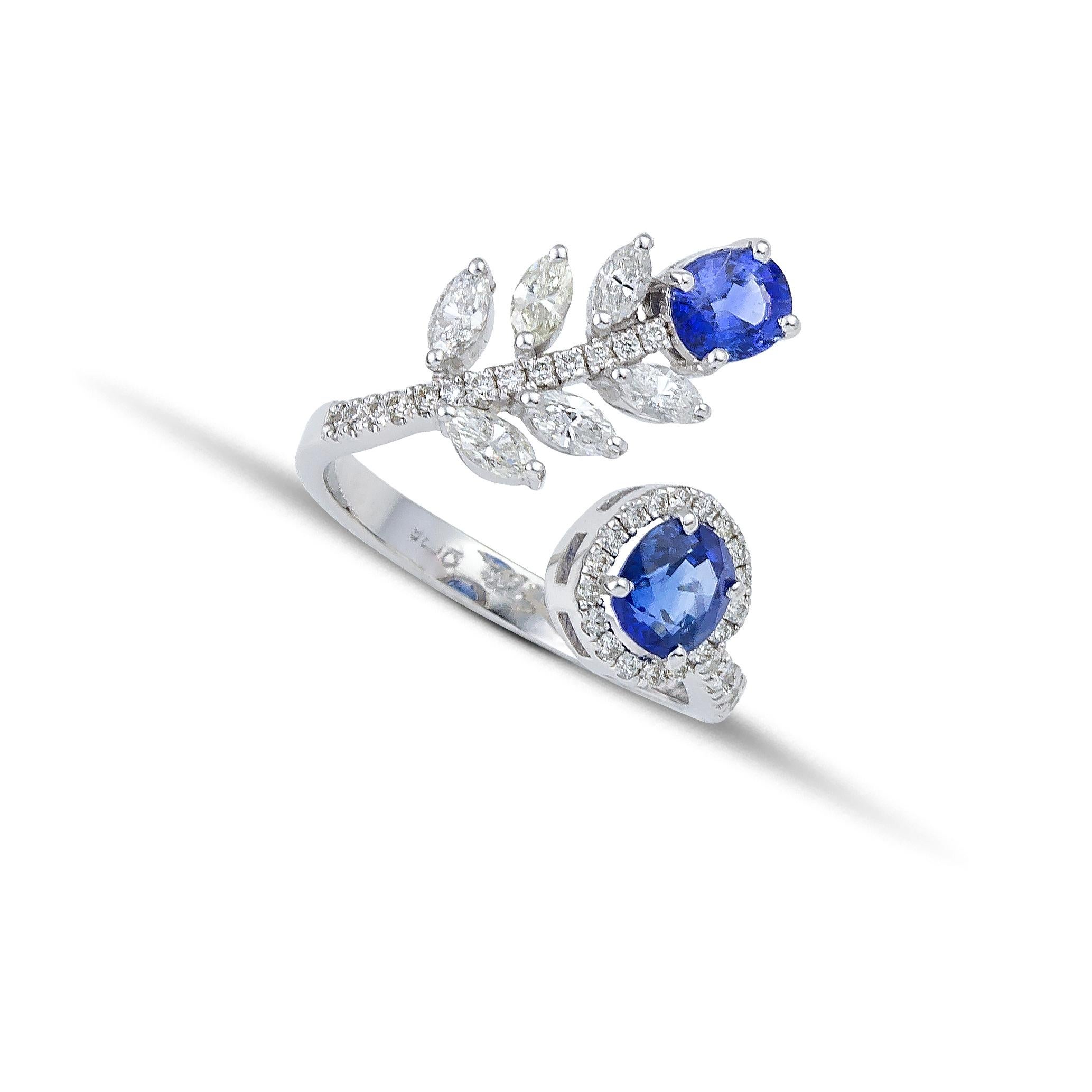 Flower Disconnected ring made of 18Kt white gold with two oval blue Sapphires and Diamonds Marquise & brilliant cut . Capturing the power of attraction, this unique ring is designed for those who dare to be different. The sapphires are carefully set