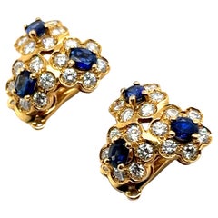 Flower Earrings with Blue Sapphires 
Diamonds in 18 Karat Yellow Gold