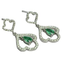 Flower Emerald Dangle Earrings in Solid Gold with 0.45 CTW Diamonds