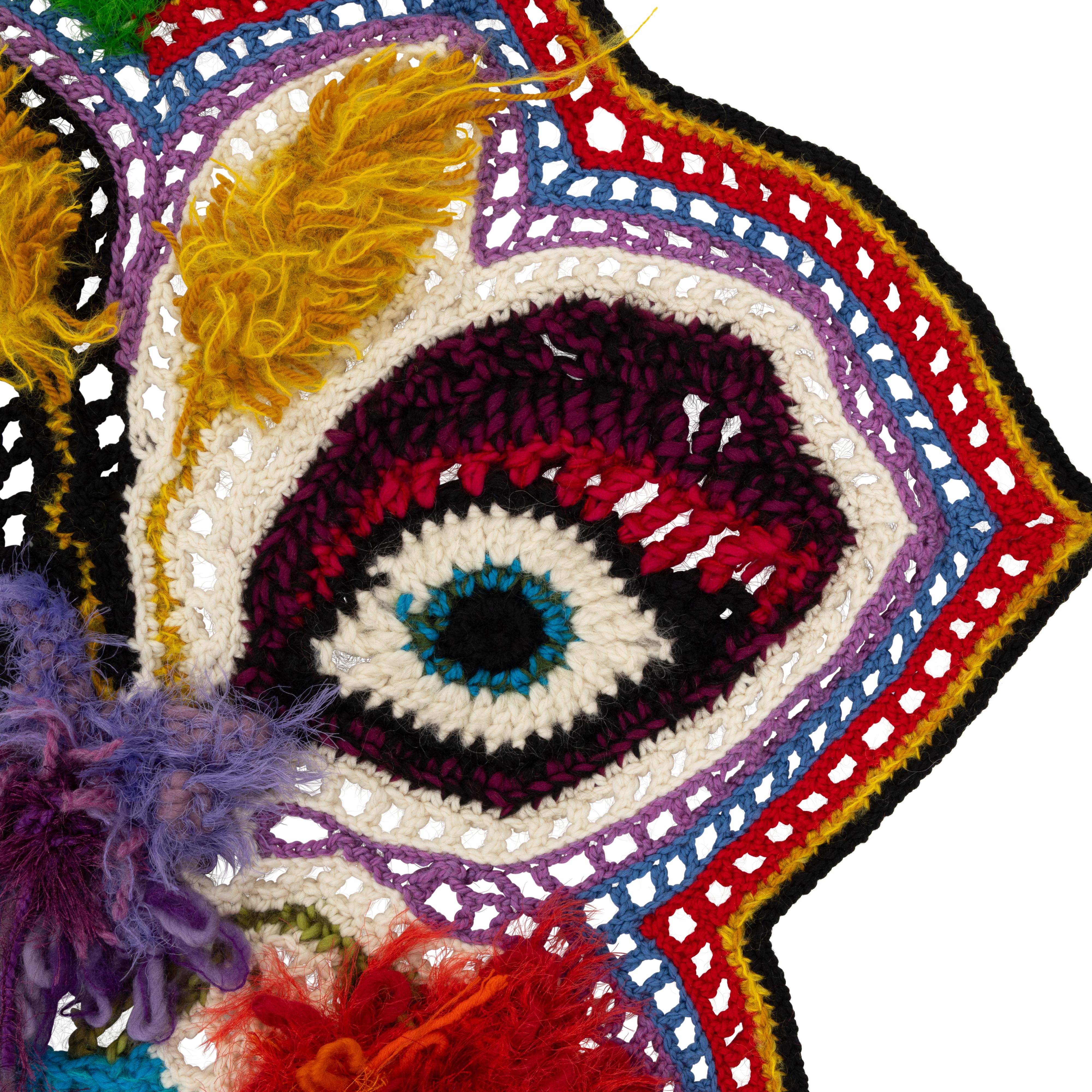 Textile Art, Hand-crafted, Crochet Art Blanket, Knitted Tapestry, Wall hanging, Affordable Art.
Multi coloured surreal vase with highly textured flowers including an eye alluding to a face . Luxurious blends of predominantly wool yarns are