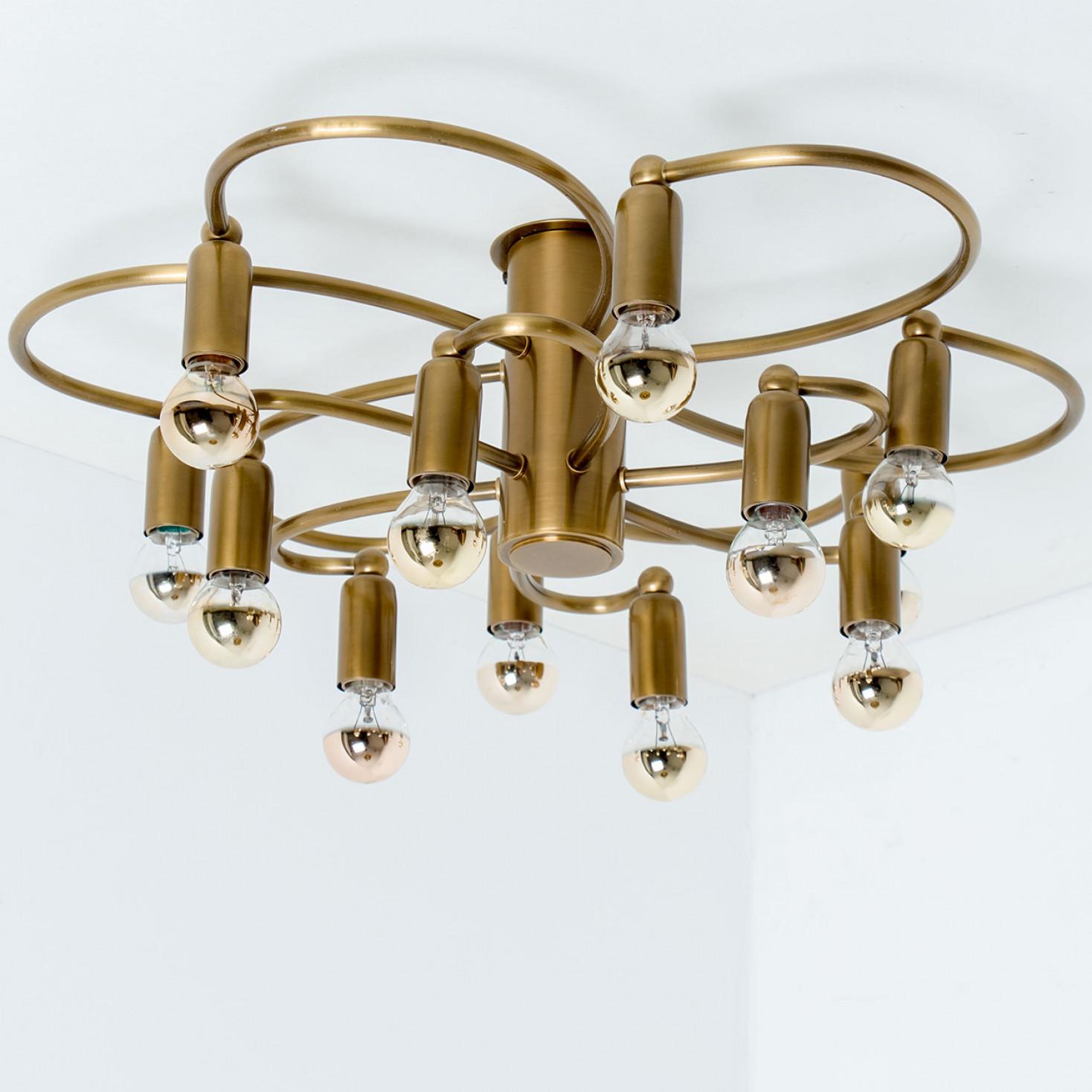 A gorgeous Sciolari-style ceiling light by Leola. Made of chromed brass in the beautiful shape of a flower, Germany, 1970s.

Dimensions:
Height: 7.08