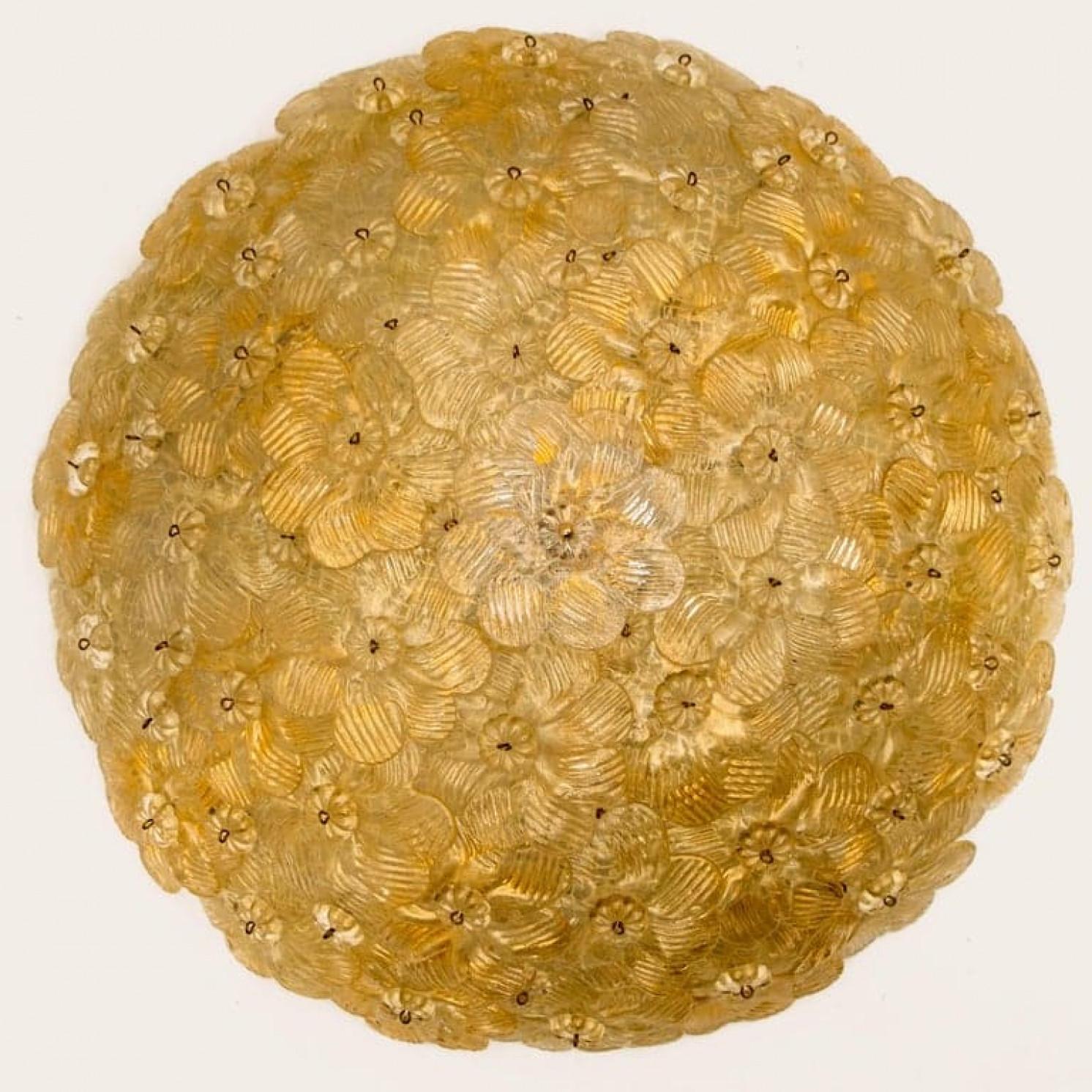 This elegant flush mount is made of dozens of small roses in precious Murano glass with gold inclusions affixed to a white painted metal mesh frame. Illuminates beautifully.

In good condition. Cleaned and well-wired, in full working order and ready