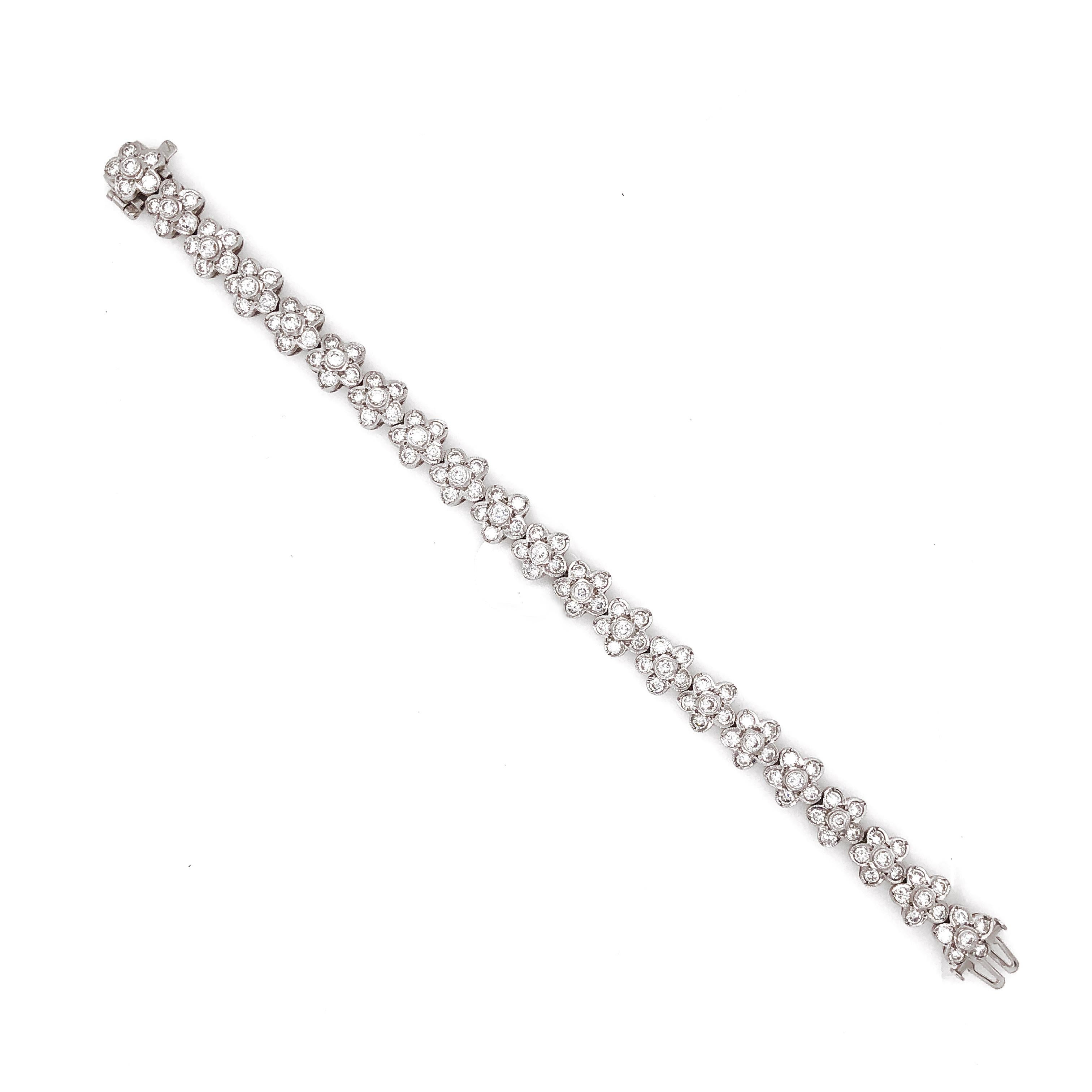 Beautiful contemporary design of flowers linked together in a diamond platinum link bracelet.
Covered by round cut white diamonds 7.79 ct in total.
Diamonds are all natural in G-H Color Clarity VS. 
Platinum 950 metal.  
Width: 0.9 cm
Length: 17.6