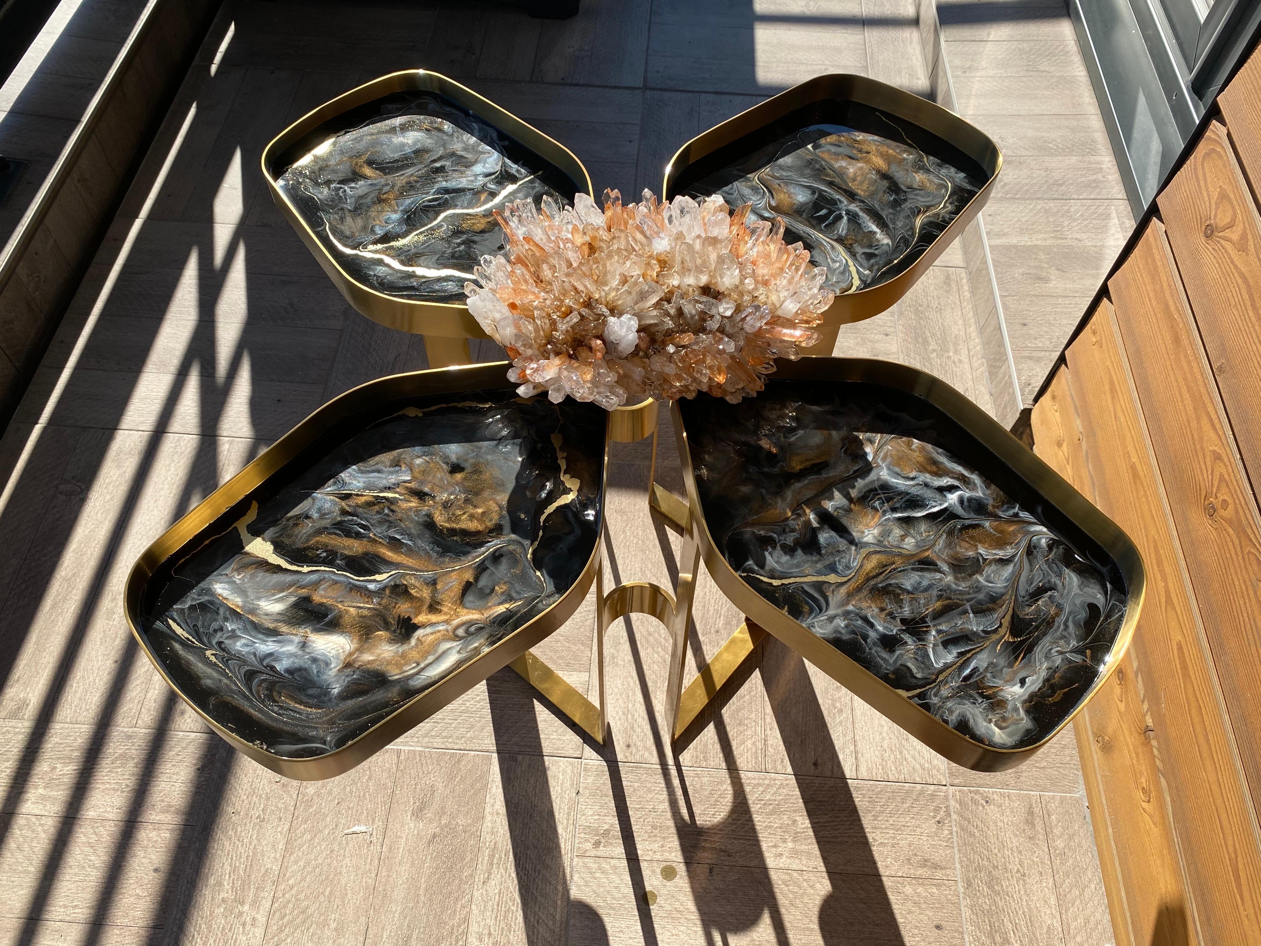 Step into luxury with our show-stopping flower-shaped table, a perfect blend of nature and artistry!

Crafted to captivate, this stunning table features a dramatic black marble effect elegantly enhanced with smooth resin. At its heart lies an