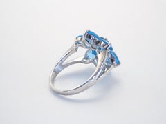 Anello con motivo floreale in argento sterling con 4,74 carati di topazio blu