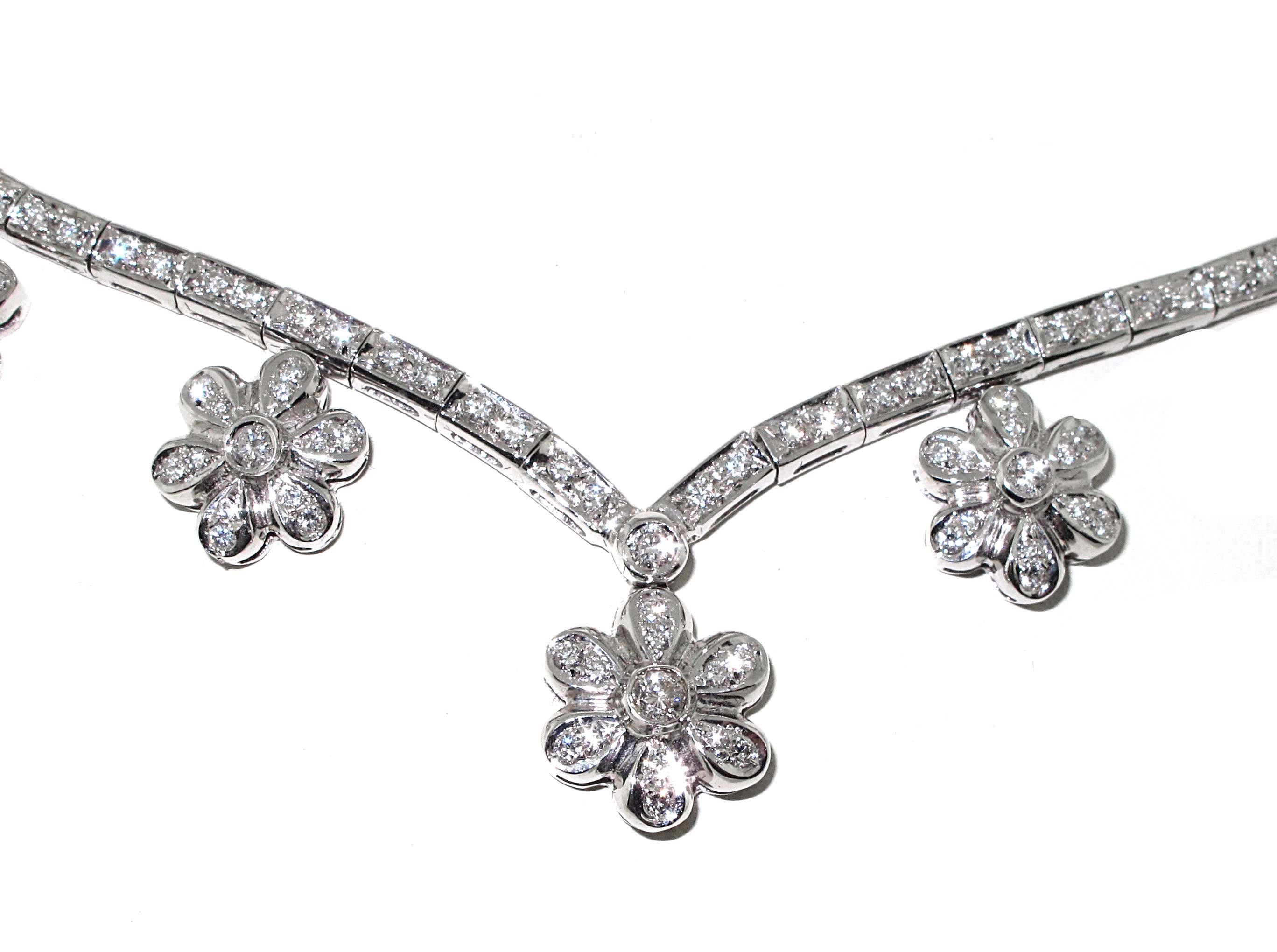 An excellent necklace for a night on the town. Over 4 carats of white diamonds set in 18kt white gold help make this flower necklace extremely unique. Very nice on the neck line because it comes to a V in the center. There are diamonds on each