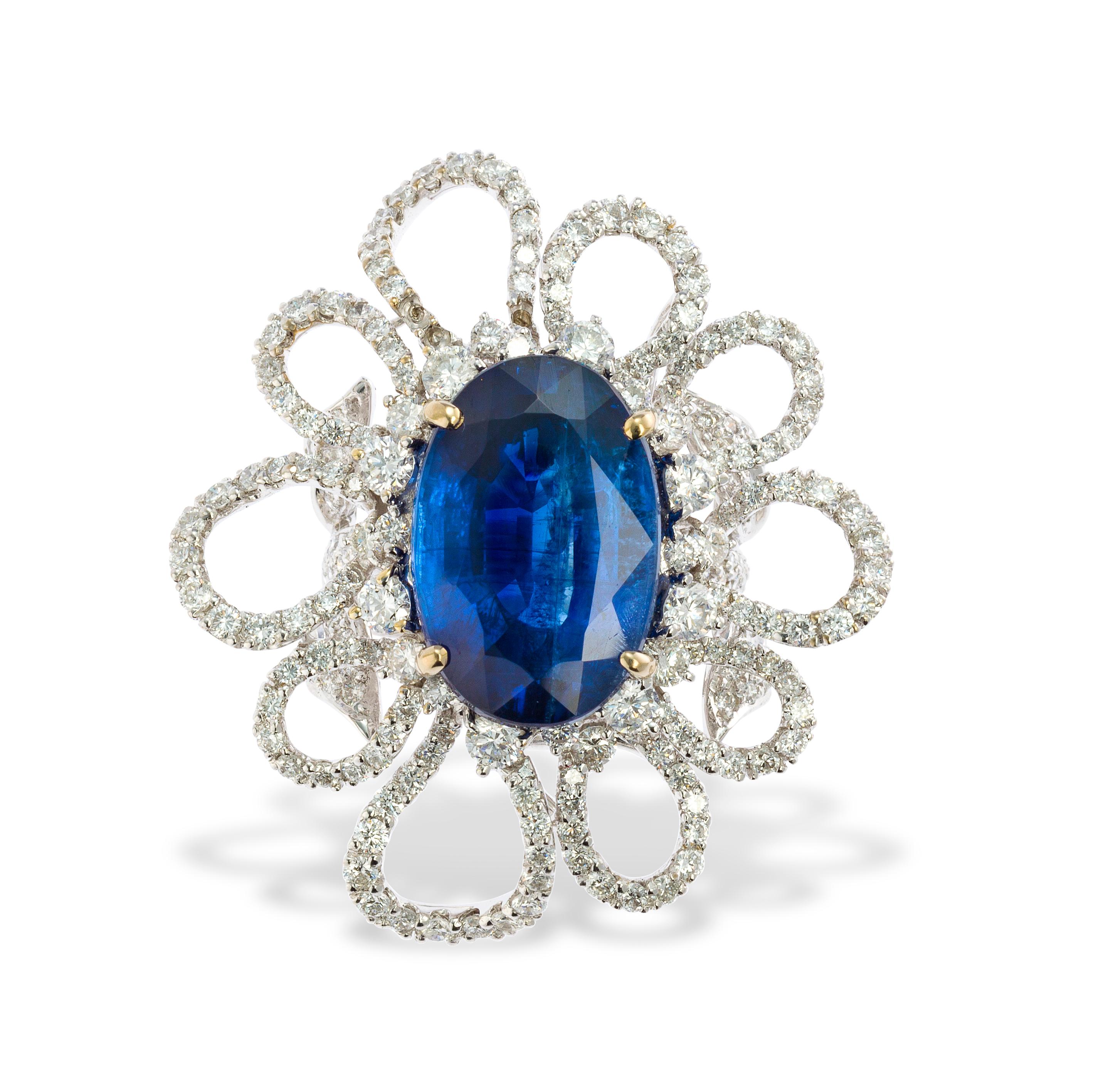 Flower Motif Sapphire & Diamond Ring

An 18 karat white gold ring set with a center oval sapphire framed by round cut diamonds

Stamped 750

Ring Size: 6.25

Resizable free of charge