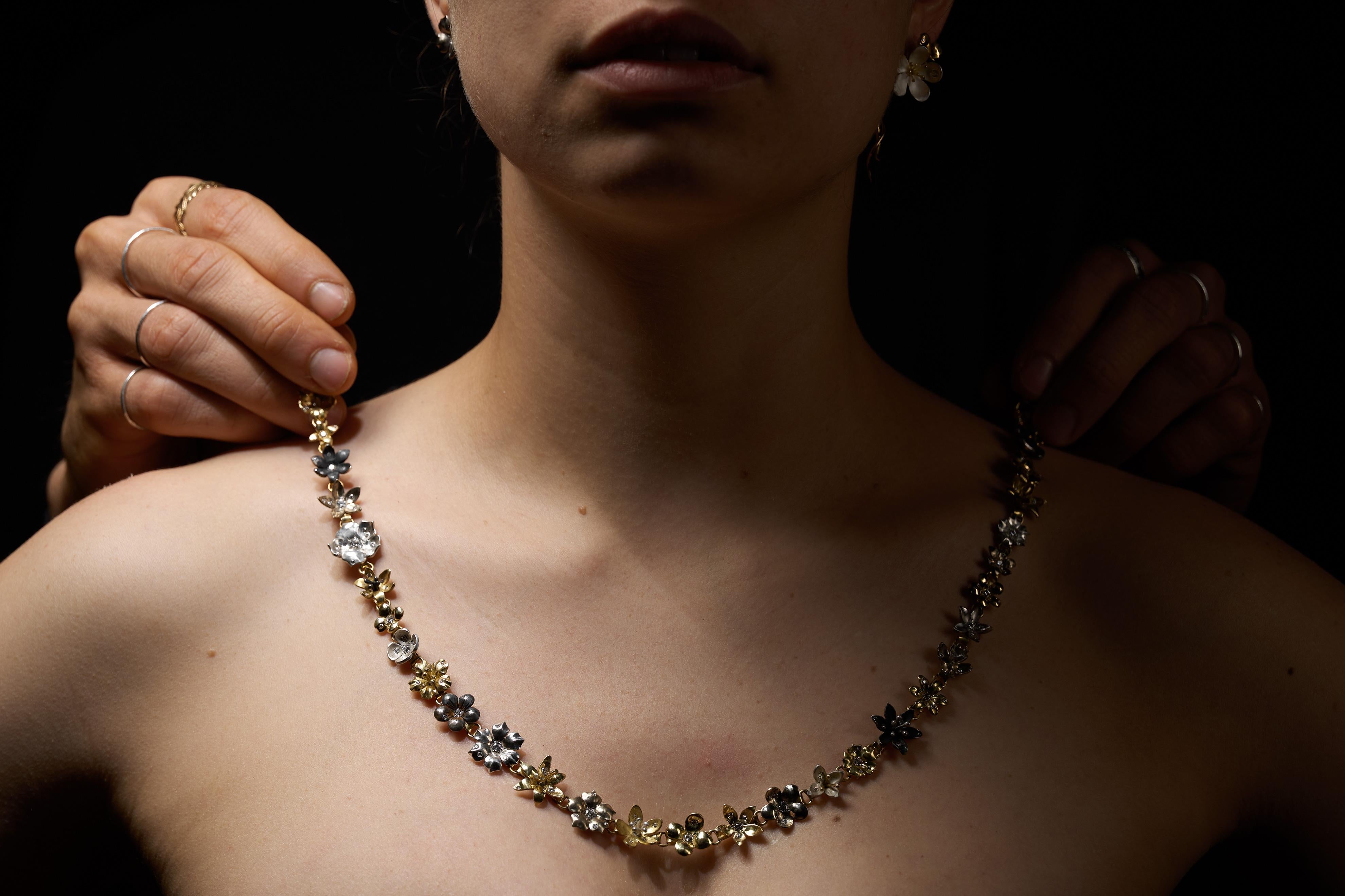 Flower necklace completely handmade in Italy with Canadamark diamonds, Fairmined silver, and different hues of 18K Fairmined gold.

The necklace, composed of thirty-three individual flowers is made to sit on the collarbone and can be customised for