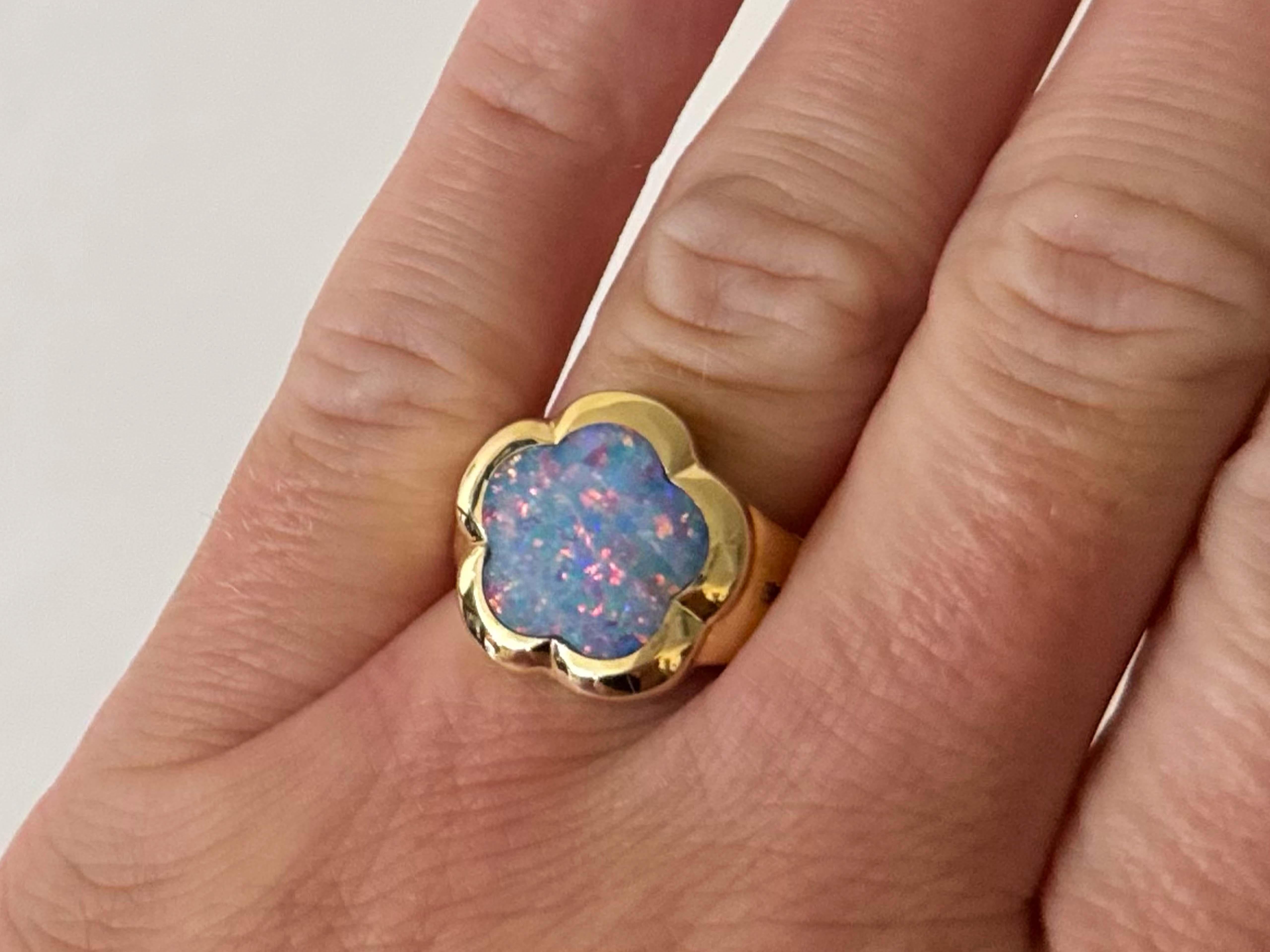 Item Specifications:

Metal: 14K Yellow Gold

Total Weight: 7.0 Grams

Ring Size: 6

Opal Count: 1 flower cut opal

Opal Diameter: 14 mm x 14 mm
​
​Diamond Count: 6 brilliant cut 

Diamond Carat Weight: 0.06 carats
​
​Diamond Color: H
​
​Diamond