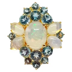 Flower Opal ring. Opal 2.60cts and Blue topaz.