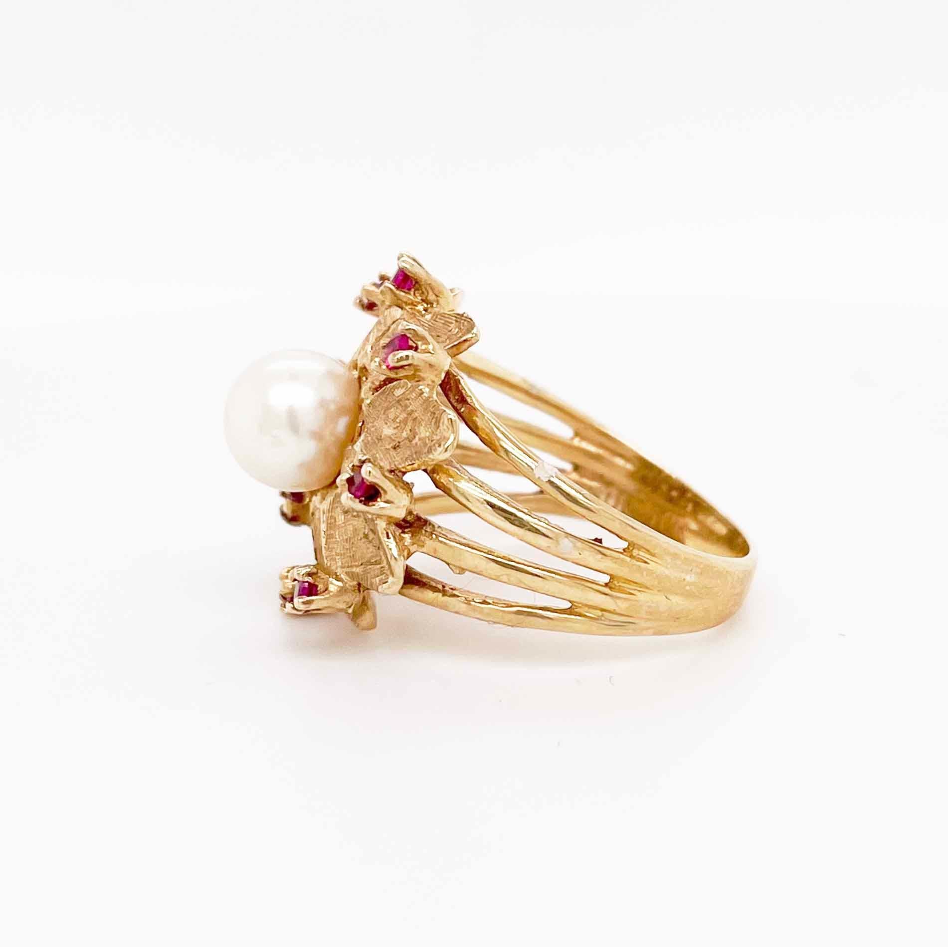 Genuine rubies and genuine, cultured peals go well together in this ring that does a great job of combining fun with classy. The flower made of gold is impressive on its own and made even more beautiful with a pearl center and ruby halo. It's a