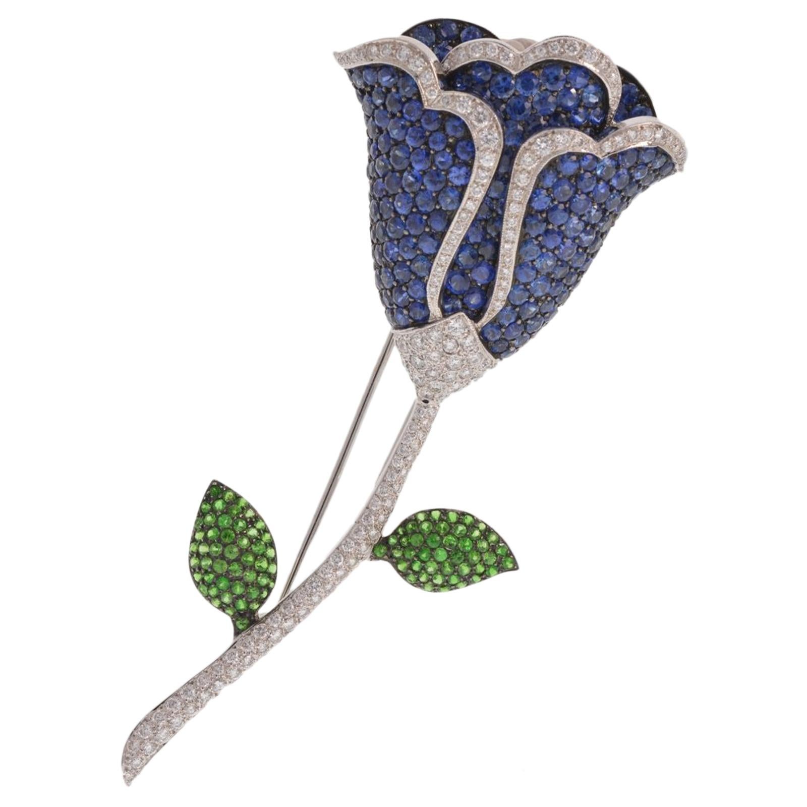 Flower Pin with Diamonds, Sapphire, and Tsavorite Garnet Set in 18 Karat Gold