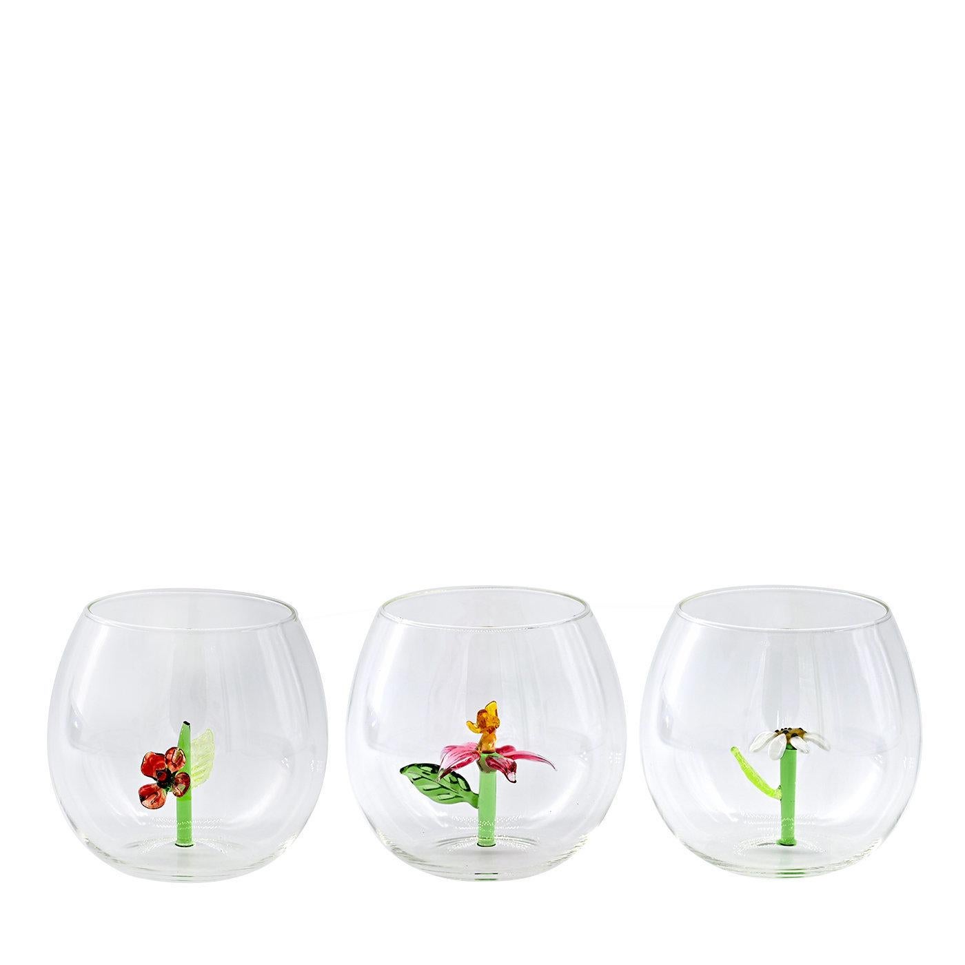 This set of six, highly original glasses and matching jug feature a variety of colored flowering, glass cactuses sprouting from their inner base. This whimsical style will add a creative, joyful touch to the dining table or while serving drinks in