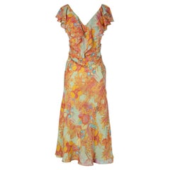 Flower printed chiffon dress with ruffles on shoulders and bust  Gai Mattiolo
