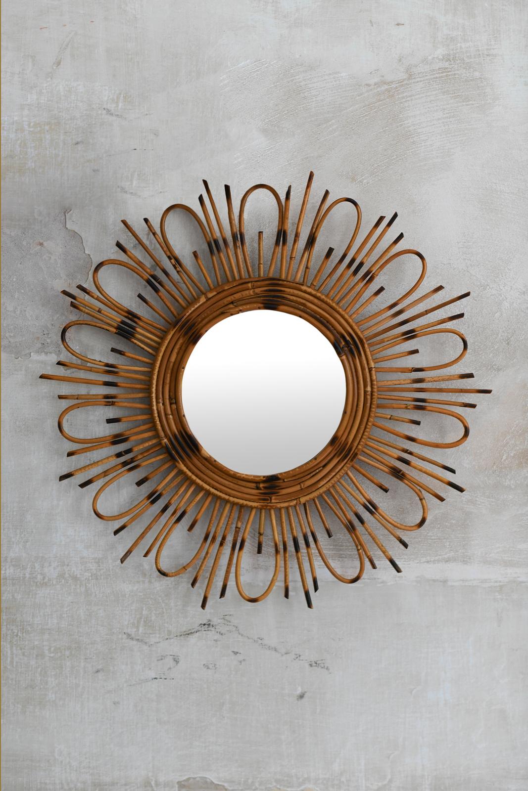 Flower rattan mirror, 1960s
Product details
Mirror with an intricate frame made of thin, hand-bent bamboo cane
Dimensions: 63 D x 4 D cm