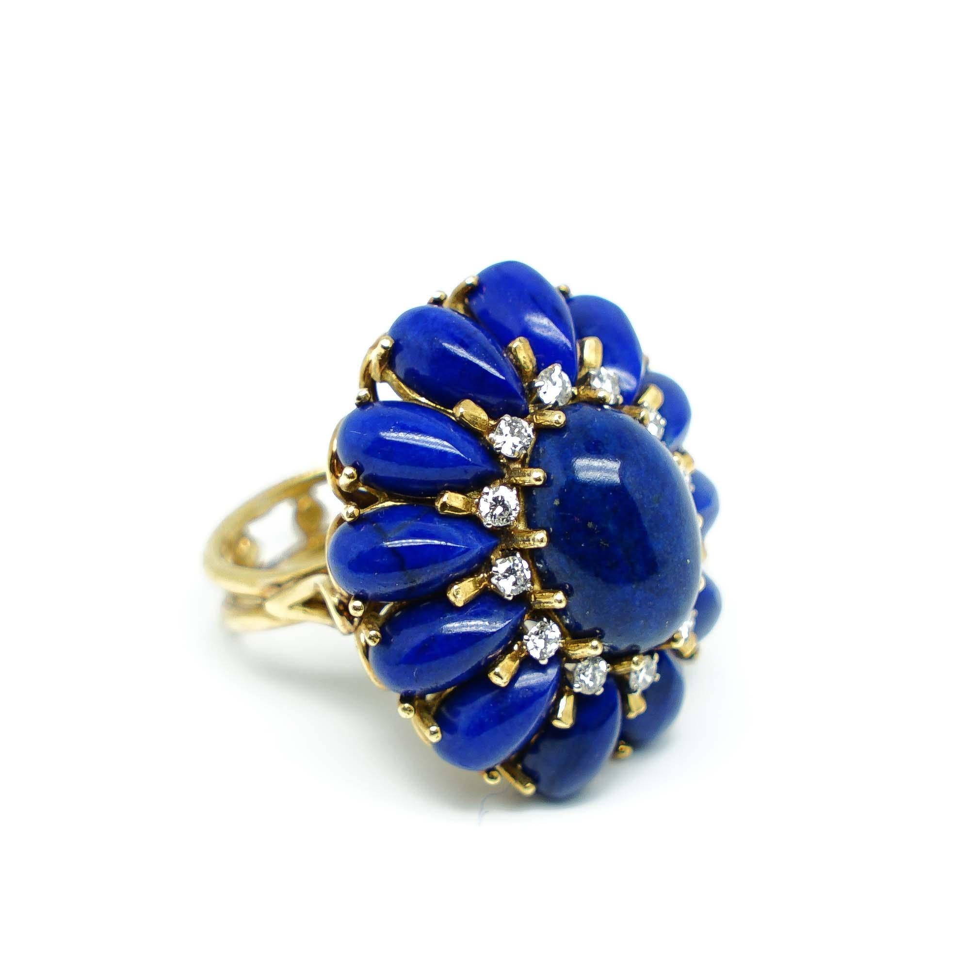 Flower Ring in Gold 18 karats with and intense Blue Lapis lazuli cabochon and Diamonds. It's a piece that has a strong and Original Design with a beautiful detailed structure totally Handmade that makes it Unique and a real Piece of Art to wear or
