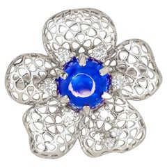 Flower ring with blue sapphire cabohon in 14k gold