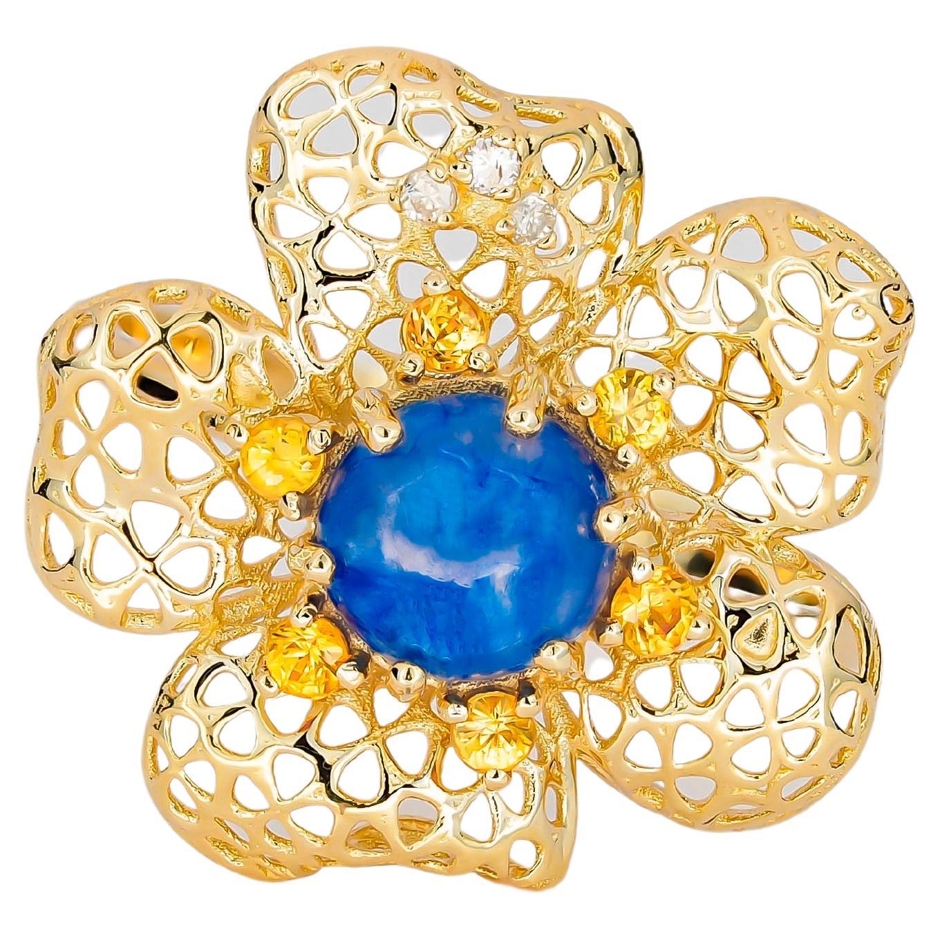 „Flower“-Ring mit zentralem Saphir, Cabochon, gelben Saphiren und Diamanten