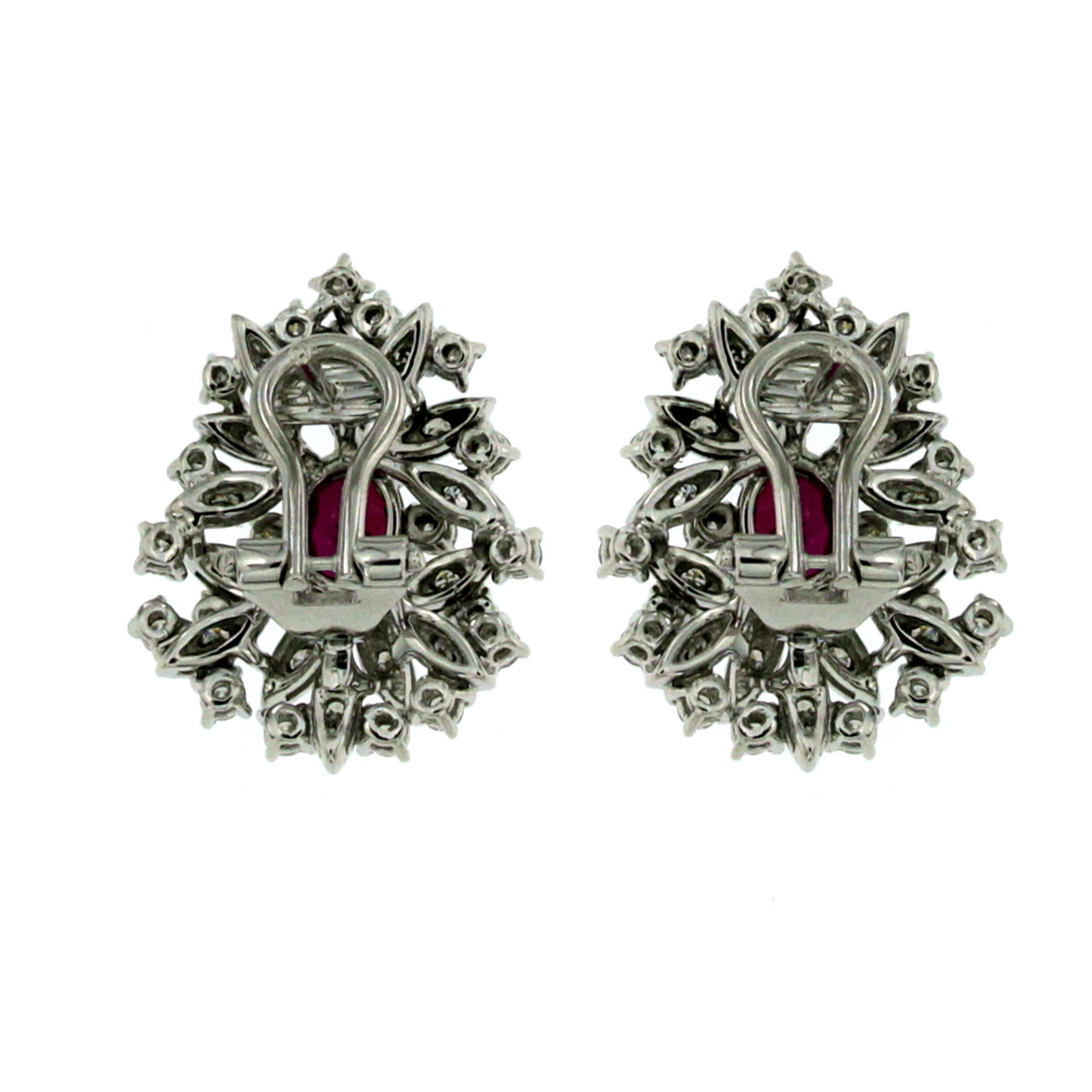 Vintage 18 karat gold Natural Ruby and diamond earrings. 
These gorgeous ruby and diamond clusters feature 2 center Ruby that are 1.06 carats each, tot. 2.12 ct, along with a total diamond weight of 1,20 carats Round Brilliant Cut Diamonds graded G