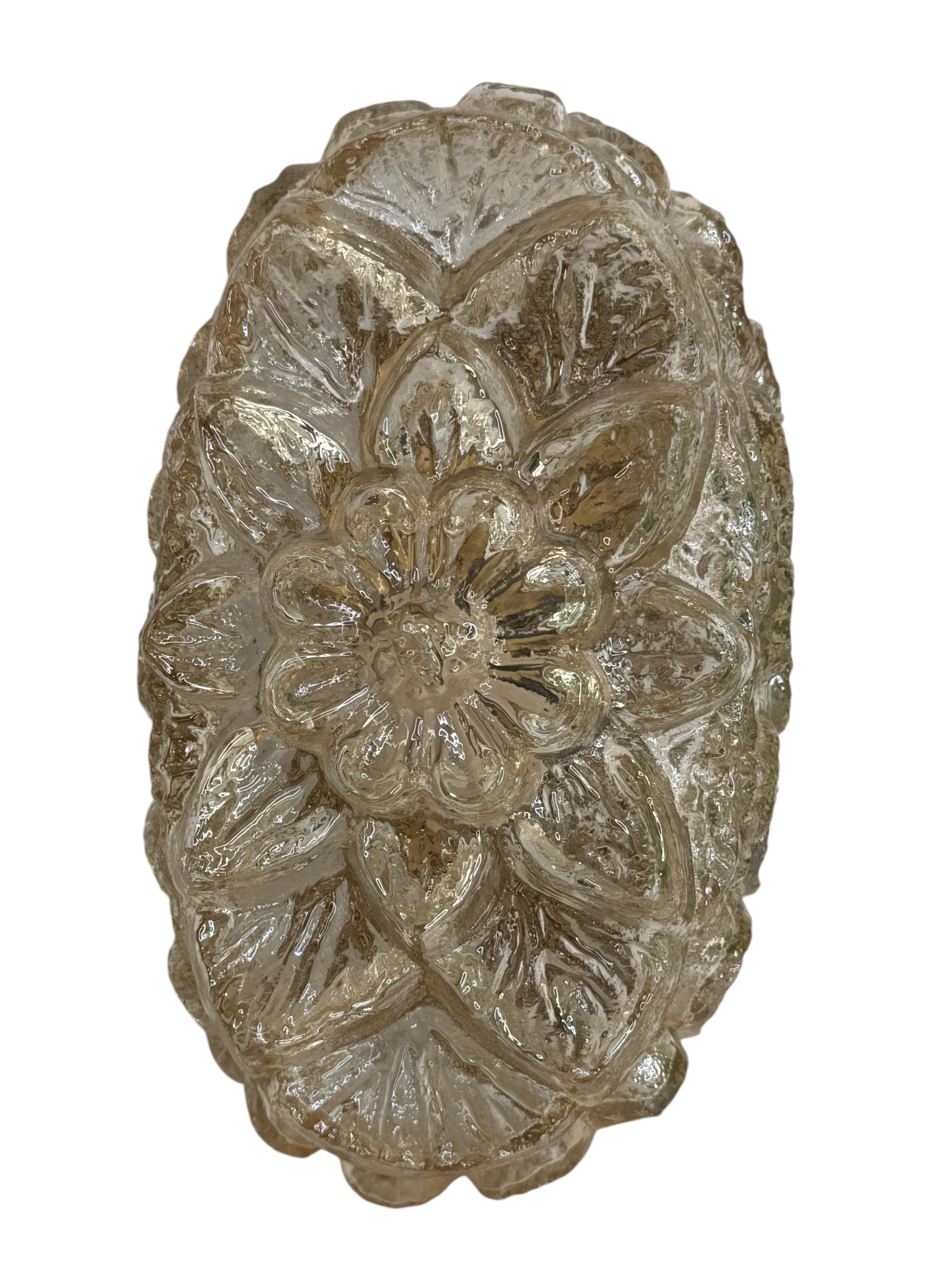 Petite sconce manufactured by Glashütte Limburg. It is an amber tone glass on a gilded metal frame. The fixture has one European style E14 socket. It requires a European E14 candelabra bulb, up to 60 Watt. A nice Wall Lamp for your entry hall or