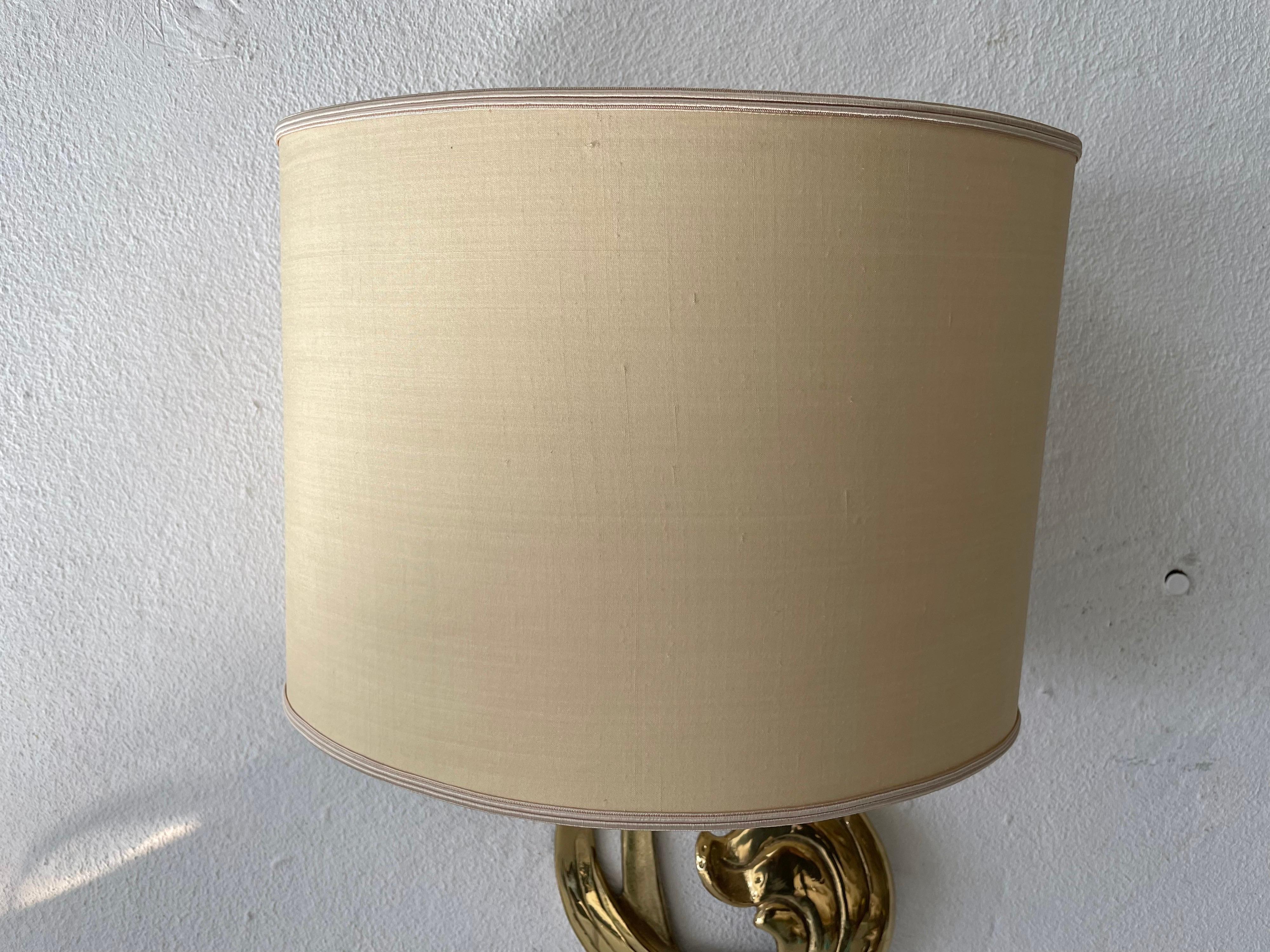 Wonderful flower shaped brass & fabric shade sconce by Hans Möller, 1960s, Germany

Sculptural very elegant rare heavy wall lamp. 

It is very ideal and suitable for all living areas.

Lamp is in good condition. No damage, no crack.
Wear
