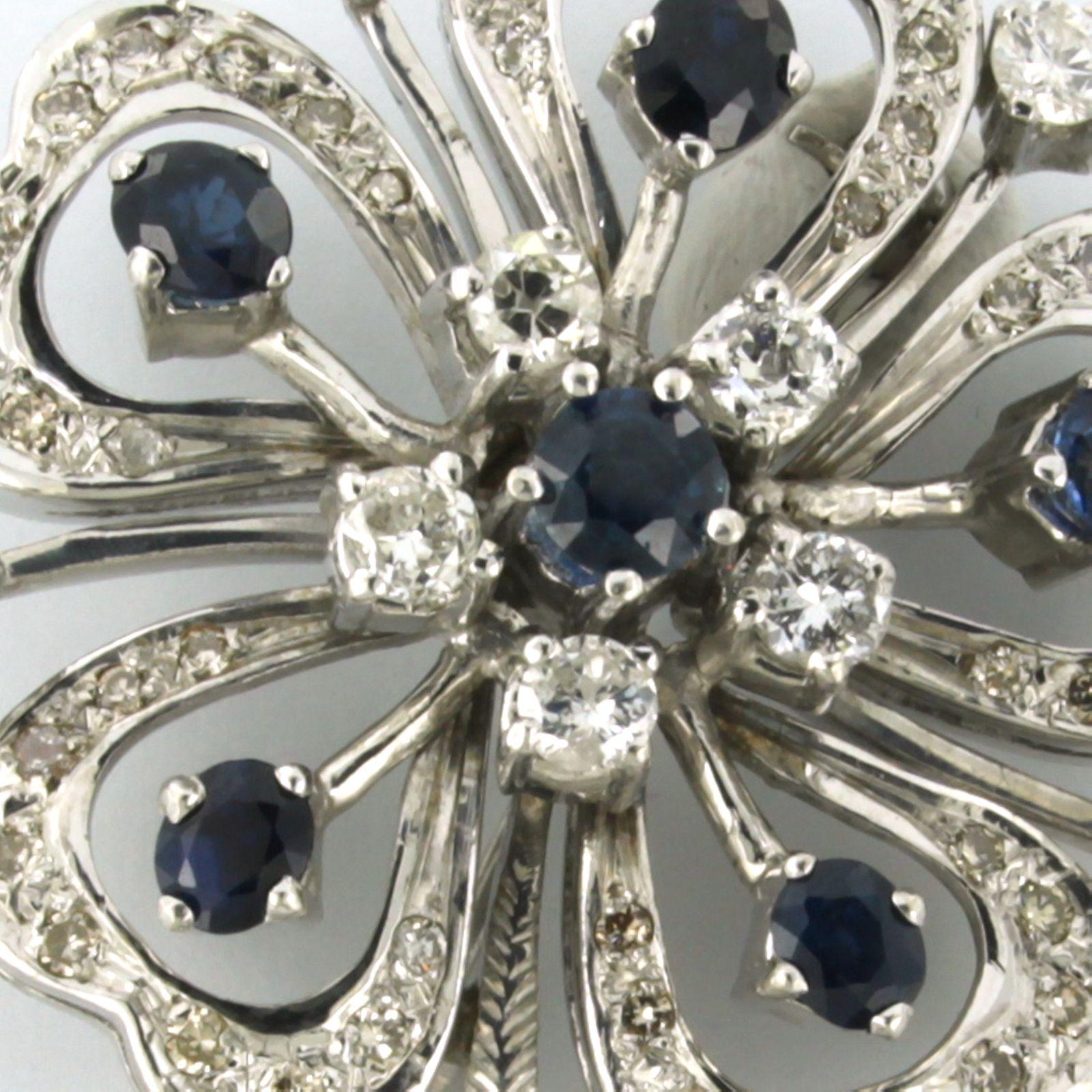 Modern Flower shaped Brooch set with sapphire and diamonds up to 1.50ct 14k white gold For Sale