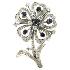 Flower shaped Brooch set with sapphire and diamonds up to 1.50ct 14k white gold