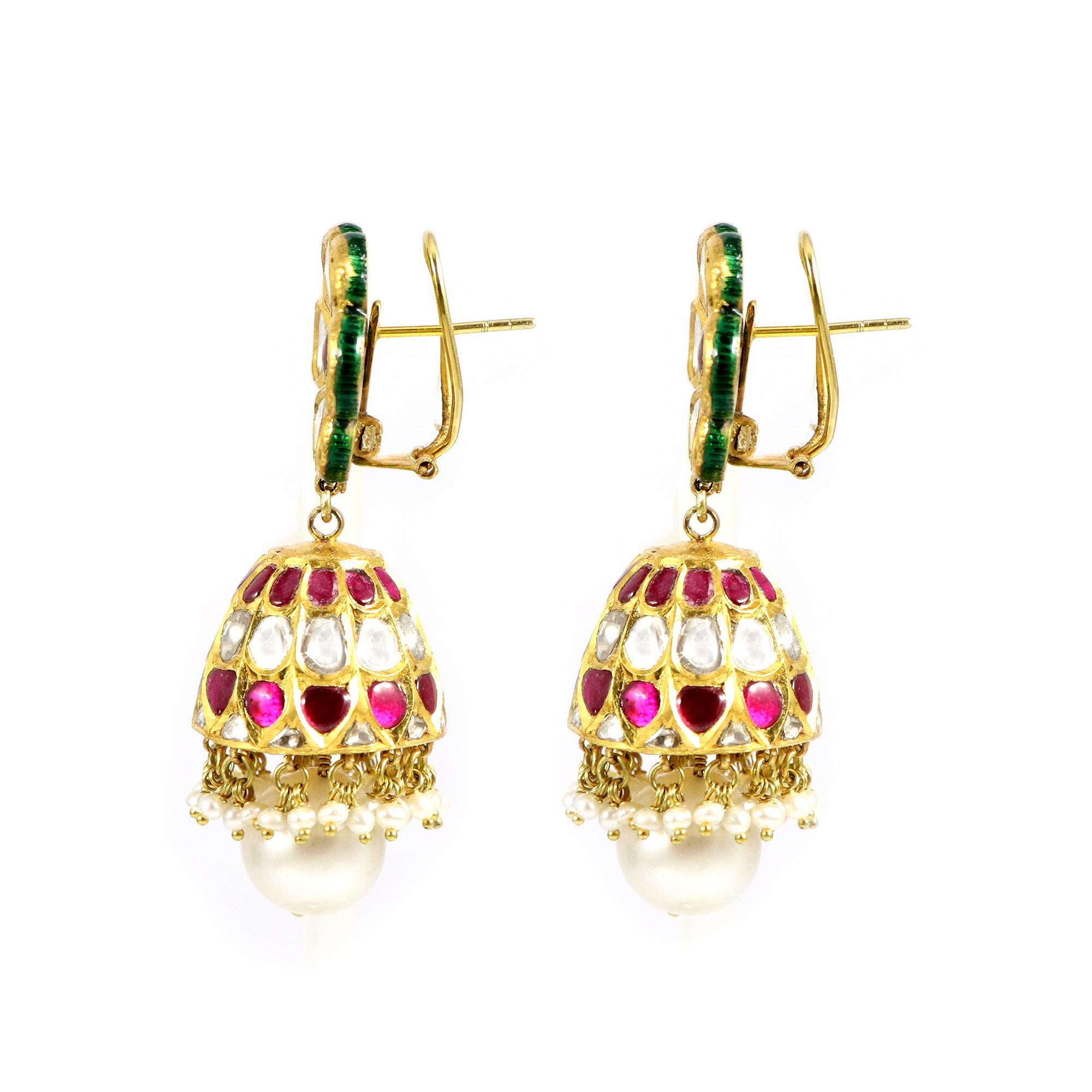Experience enduring elegance with our flower-shaped Ruby and Polki Jhumki earrings. These stunning pieces of jewelry are crafted with precision and feature vibrant rubies and sparkling polki stones arranged in a captivating floral design and