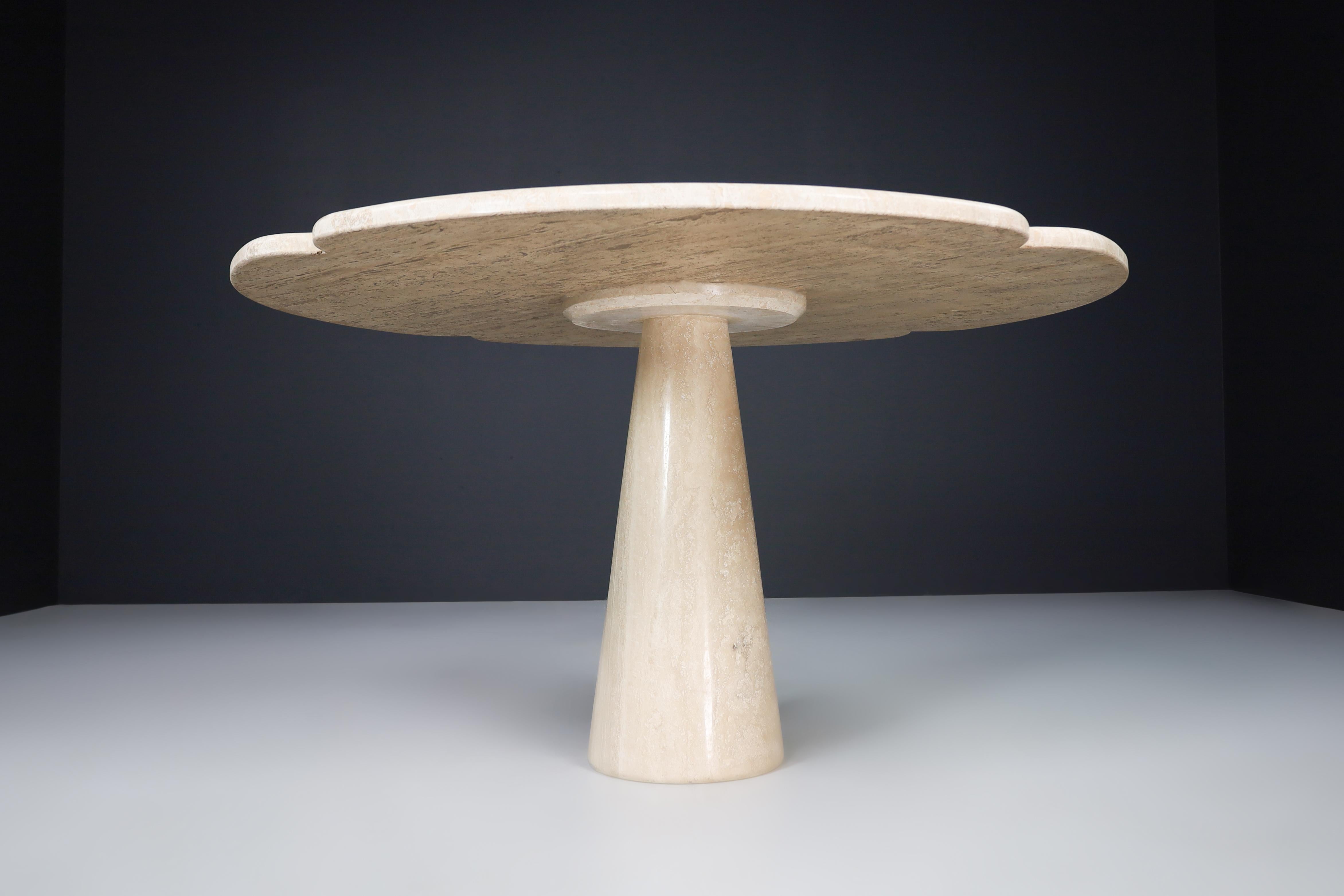 Flower-shaped top travertine dining table, Italy 1970s 

Beautiful flower-shaped top travertine dining table or centre table made in Italy in the 1970s. The thick heavy top sits on a solid travertine cone. Therefore, a lovely contrast is created