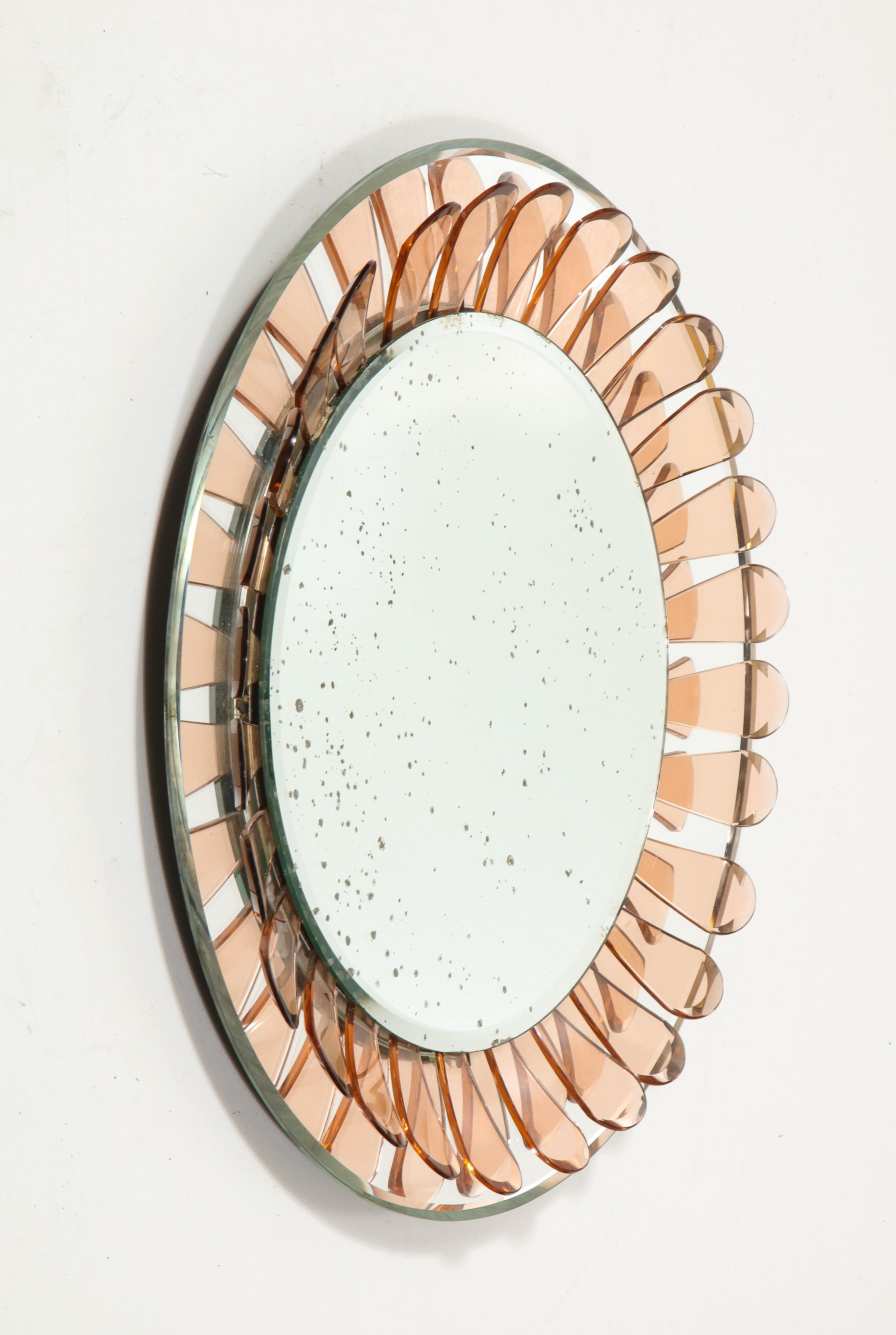 Wall mirror by Max Ingrand for Fontana Arte, Italy, circa. 1960.

This striking, flower-shaped wall mirror designed by Max Ingrand features curved pink petals and beautifully patinated mirrored glass.