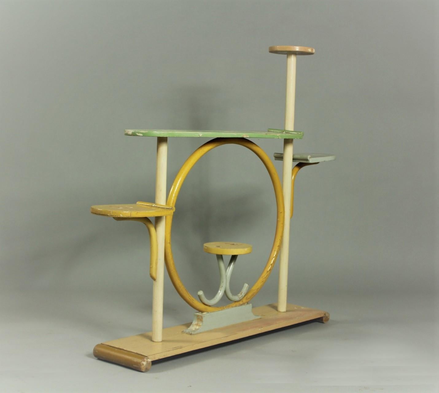 Thonet flower stand from the 1930s. The material is bentwood and lacquered solid wood. It is labeled with Thonet factory label. This flower stand is in original condition with patina.