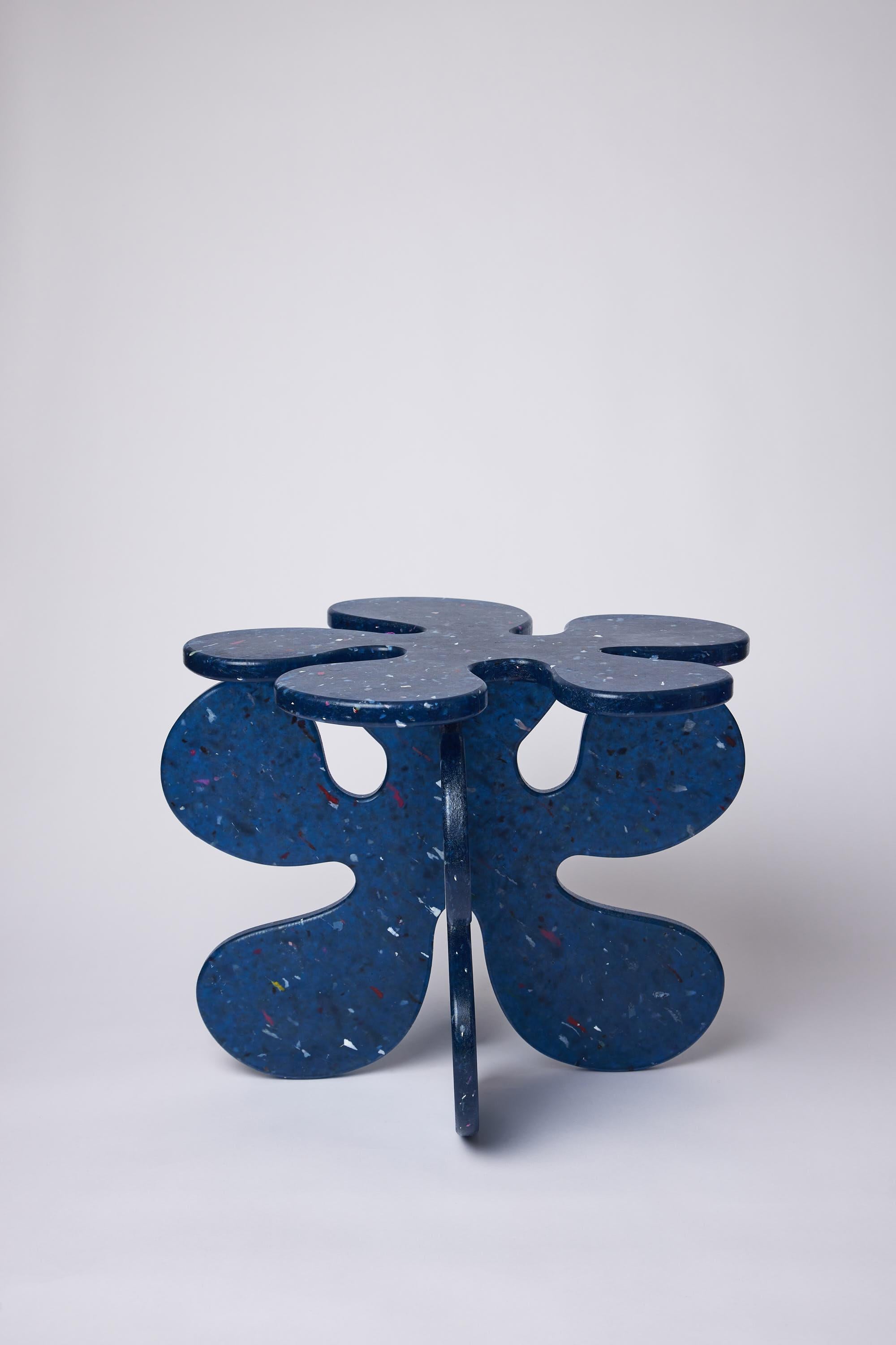 squares & things' signature Flower Table design gets reimagined in 100% recycled plastics. Made entirely from recycled plastic packaging and ocean waste, the table can be recycled itself, becoming part of the circular economy. Pictured is the table