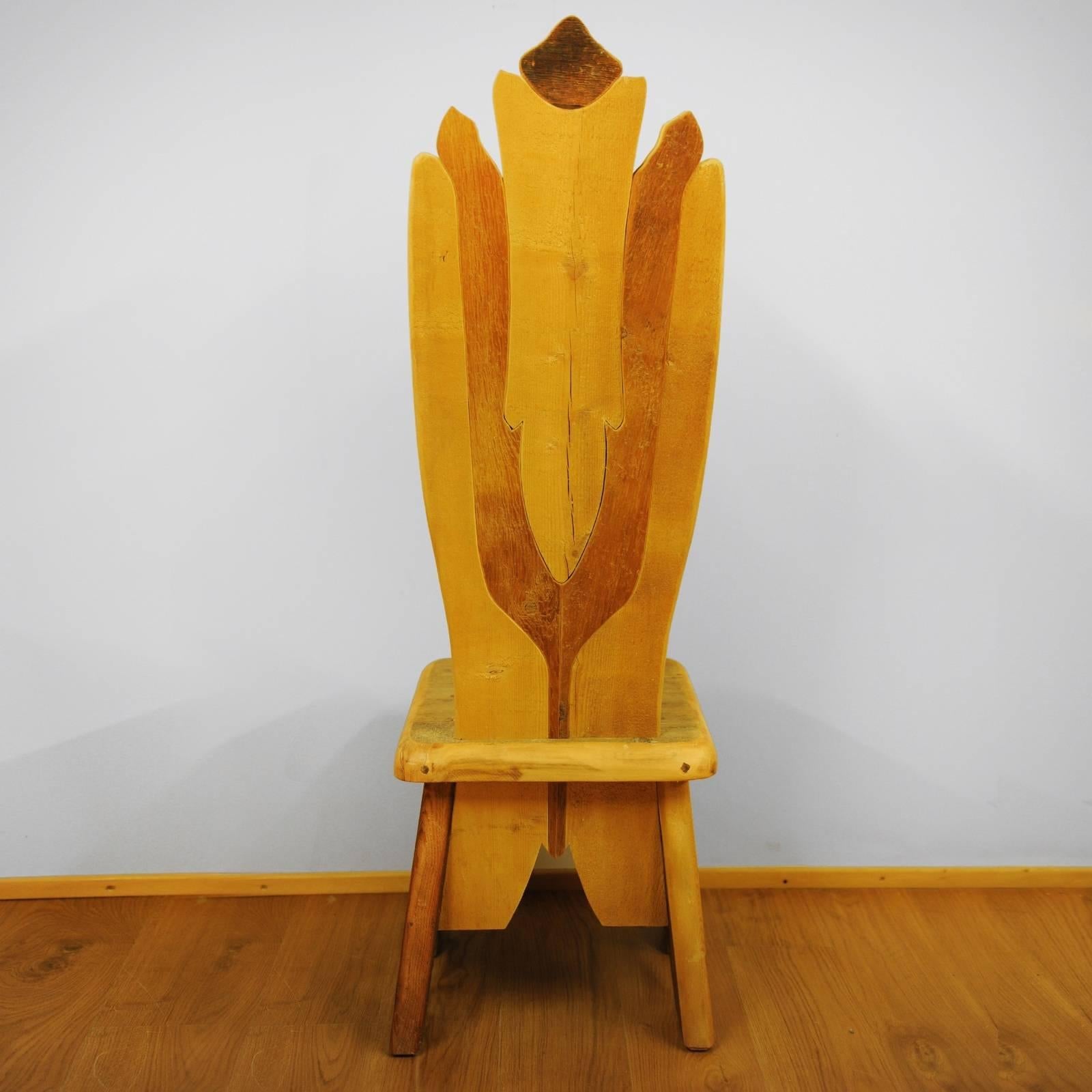 Like an elongated flower opening its petals to the sun, the stunning profile of this chair will add grace and character to a modern or rustic home, either as accent or dining chair. Crafted using fir, Swiss pine, pine, and larch coming from the