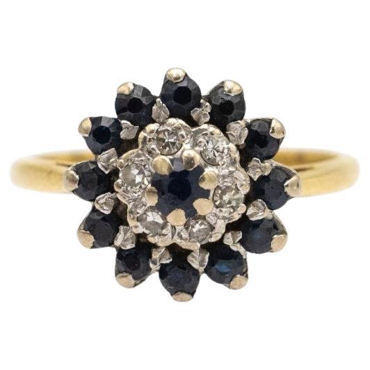 Flower vintage ring with diamonds and sapphires, UK, 1960s.