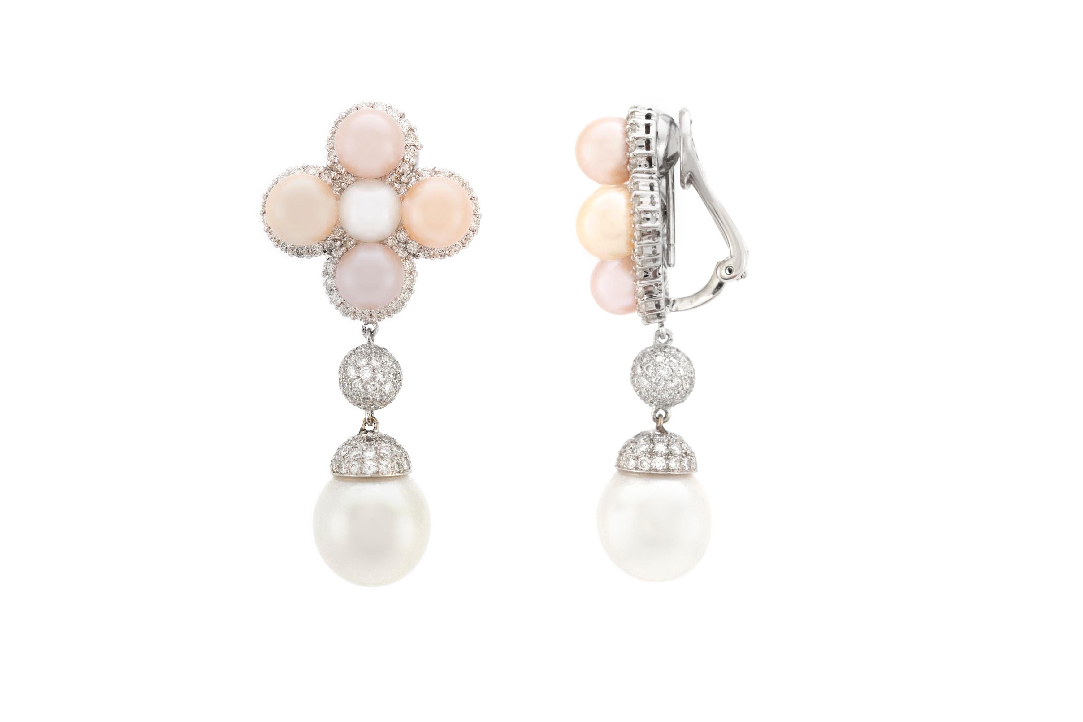 The earring is finely crafted in 18k white gold with pearls and diamonds weighing approximately total of 3.45 carat.